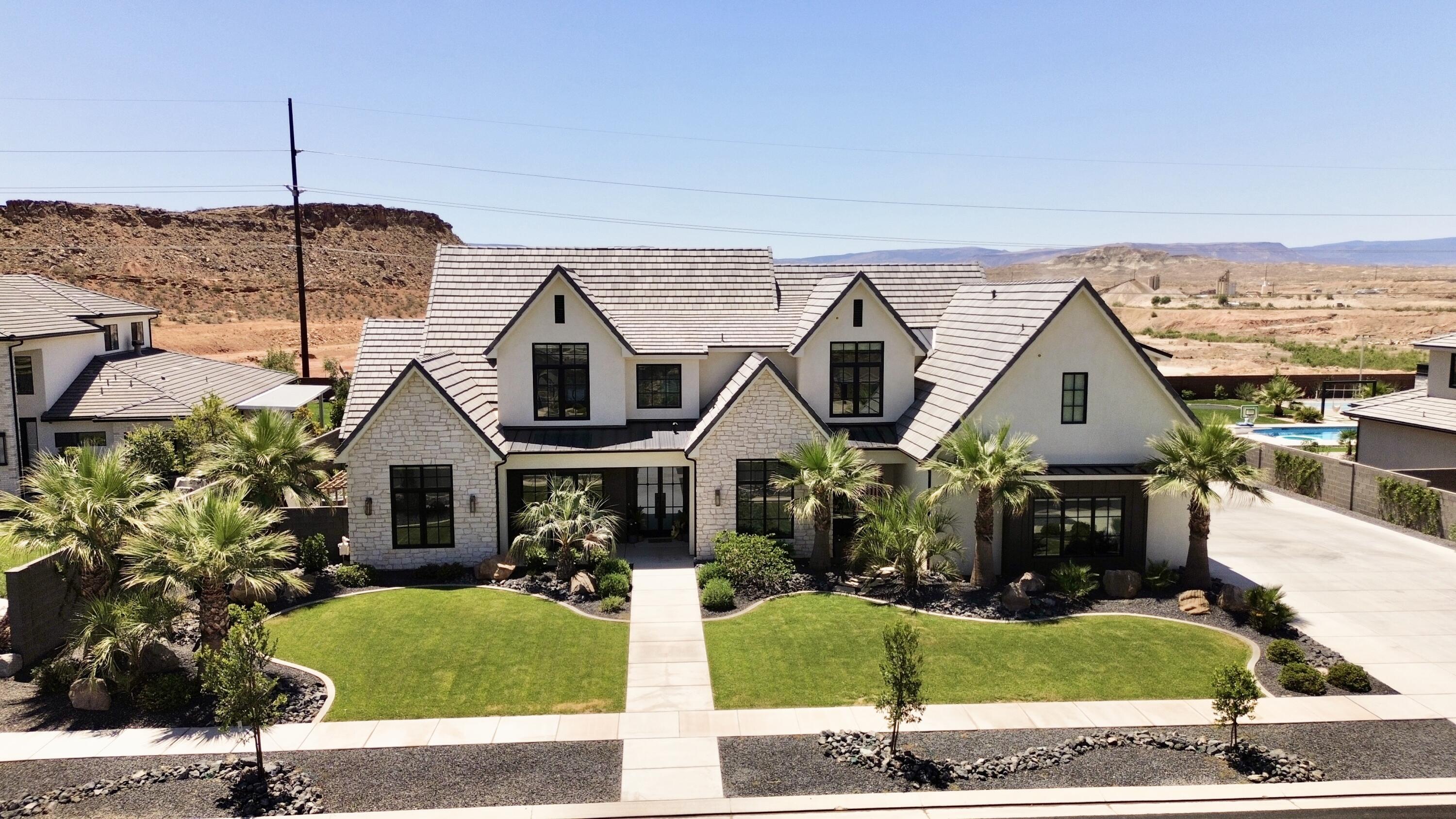 SELLER IS OFFERING A $50,00 BUYER CREDIT with ANY FULL PRICE OFFER. Use it for a rate buy down or toward a  amazing pool house. Enjoy Luxury Living in this 5600+ SQFT custom built home built in 2023. Experience the breath taking views with no backyard neighbors. Designed with comfort and entertainment in mind. This exceptional property features 5 bedrooms 5.5 baths including 3 private full suites. 
The gourmet kitchen is packed with premium upgrades including 2 dishwashers a huge walk in pantry, Drinking fountain, Hide a hose central vac and many other high end features through the home. 
The home also features a custom gas fireplace, Upgraded windows 3 Sliding glass doors, Built in speakers and wired security cameras.
The spacious layout offers a home gym, upstairs Kitchenette, 3 separate laundry areas including one in the master closet. The home was built with efficiency in mind featuring a tankless water heater, 2 separate EV Charging areas in the garage, 3 HVAC Systems that run on duel fuel. Park your 4 full size vehicles on the georgous Epoxy flooring with room to spare. 
Step outside to your own private resort style backyard featuring a pool, Hot tub, Putting green, full size Pickleball court and lighting system for those dark evenings, in ground trampoline, also grow your own produce in your amazing garden beds.Owner/Agent.