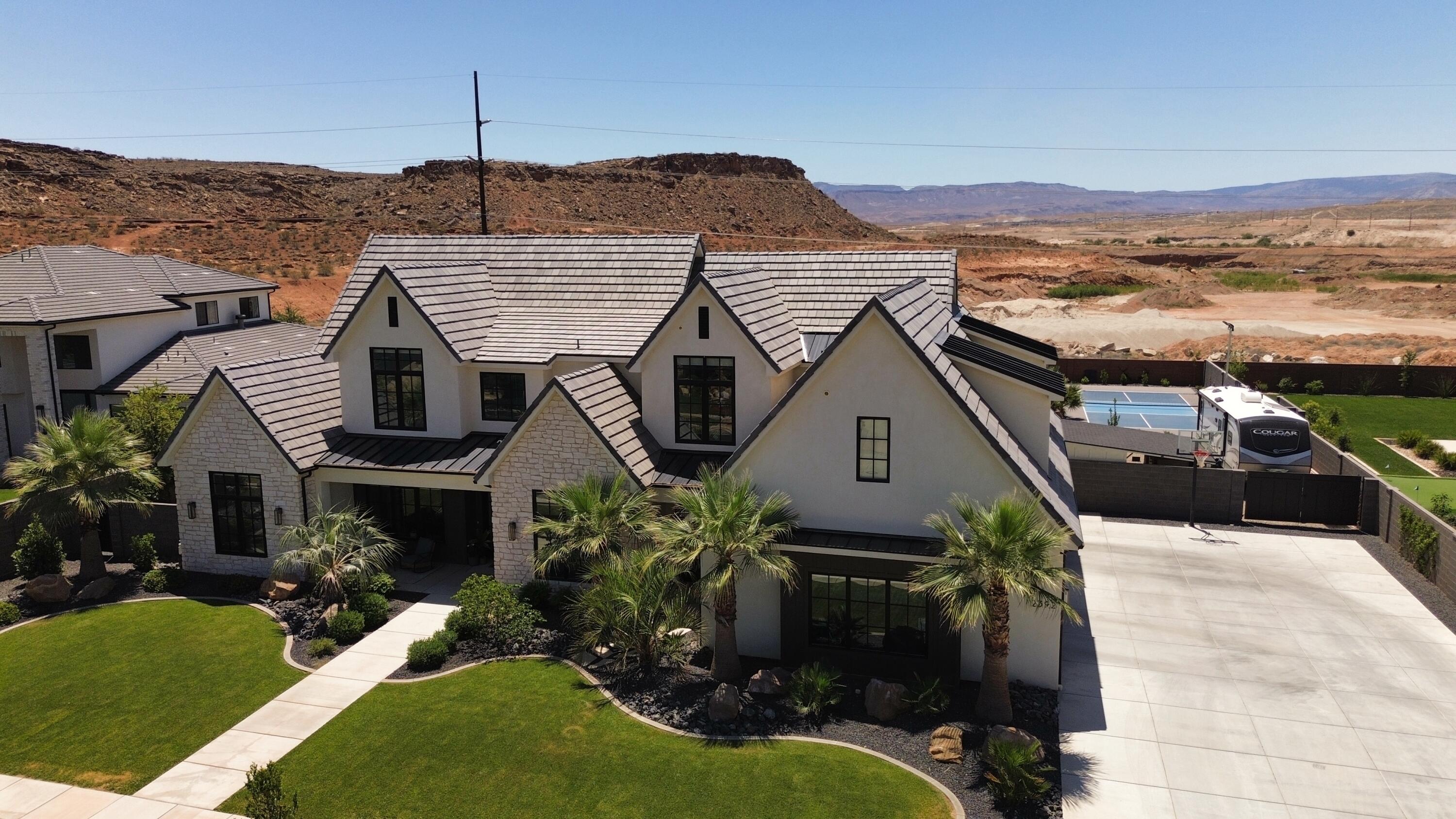 SELLER IS OFFERING A $50,00 BUYER CREDIT with ANY FULL PRICE OFFER. Use it for a rate buy down or toward a  amazing pool house. Enjoy Luxury Living in this 5600+ SQFT custom built home built in 2023. Experience the breath taking views with no backyard neighbors. Designed with comfort and entertainment in mind. This exceptional property features 5 bedrooms 5.5 baths including 3 private full suites. 
The gourmet kitchen is packed with premium upgrades including 2 dishwashers a huge walk in pantry, Drinking fountain, Hide a hose central vac and many other high end features through the home. 
The home also features a custom gas fireplace, Upgraded windows 3 Sliding glass doors, Built in speakers and wired security cameras.
The spacious layout offers a home gym, upstairs Kitchenette, 3 separate laundry areas including one in the master closet. The home was built with efficiency in mind featuring a tankless water heater, 2 separate EV Charging areas in the garage, 3 HVAC Systems that run on duel fuel. Park your 4 full size vehicles on the georgous Epoxy flooring with room to spare. 
Step outside to your own private resort style backyard featuring a pool, Hot tub, Putting green, full size Pickleball court and lighting system for those dark evenings, in ground trampoline, also grow your own produce in your amazing garden beds.Owner/Agent.