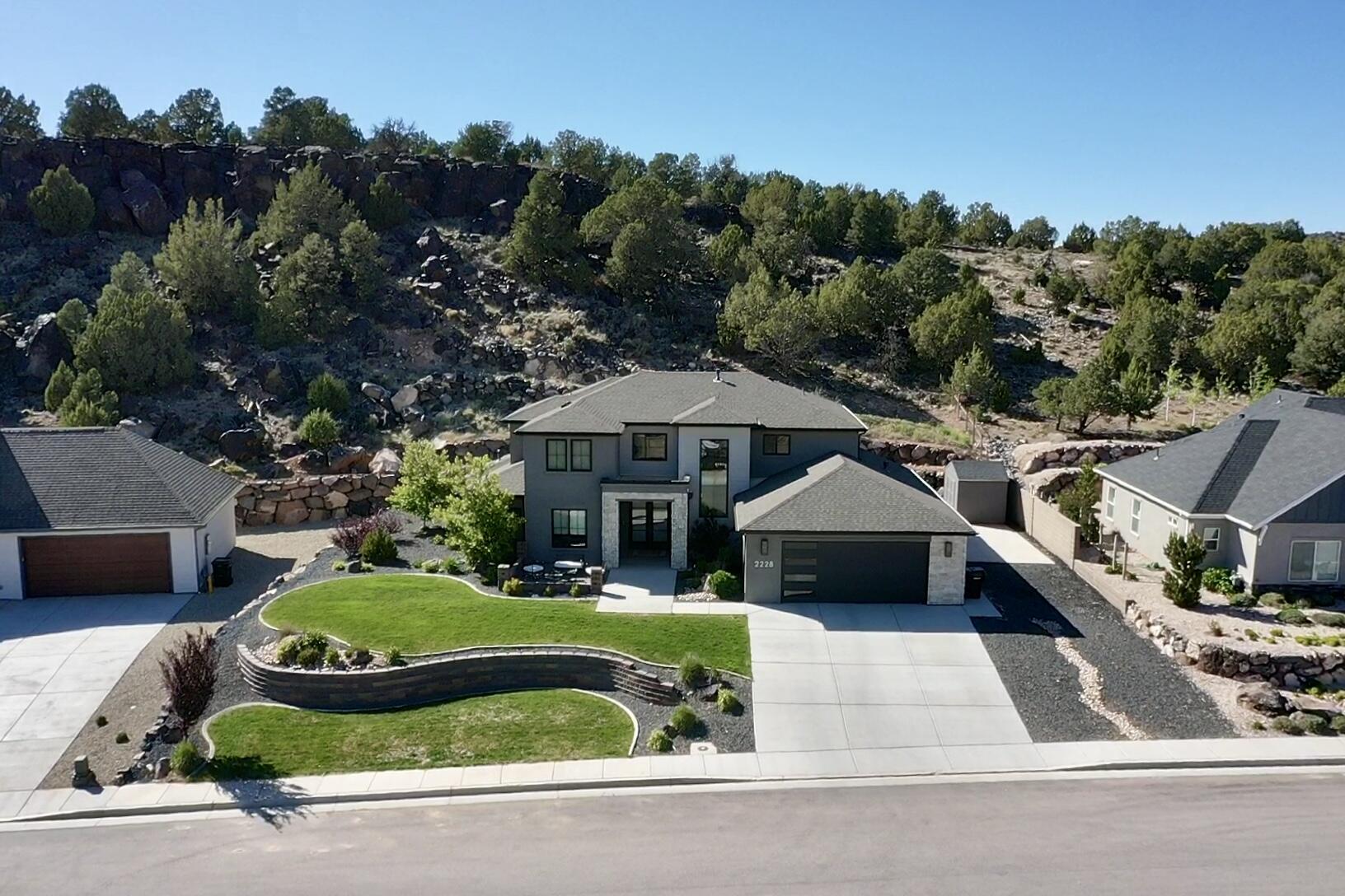 Welcome to the Canyons at Eagle Ridge! Built in 2022 by Alex Meisner Construction, this stunning modern home offers the perfect blend of style, functionality, and quality craftsmanship. Situated on a spacious 0.34-acre lot, this 4-bedroom, 3.5-bath home features 3 car tandem garage, 2,861 sq ft with a highly desirable main-level master suite. The grand entry with double front doors opens to a bright, open-concept layout filled with natural light, large windows, and a beautiful electric fireplace. The kitchen, living, and dining areas flow seamlessly--perfect for everyday living and entertaining. A loft overlooking the living room adds character and flexible space, along with a dedicated office.

The primary suite offers a luxurious retreat with a soaking tub, separate vanity, and elegant finishes. Additional highlights include a mudroom off the 2-car garage, a spacious laundry room with sink and extra storage, and a fully landscaped yard.

One of the best parts of this home is the lifestyle it offers. Enjoy breathtaking views of Southern Utahs Mountains through the expansive front windows and peaceful mountain views out the back, often with wildlife passing through. The neighborhood is filled with genuinely great people - from young families to retirees - and has such a welcoming friendly feel thats hard to leave. Located on a quiet, low-traffic road, it's ideal setting for kids to safely play and ride bikes, adding to the comfort and livability of this already incredible home!