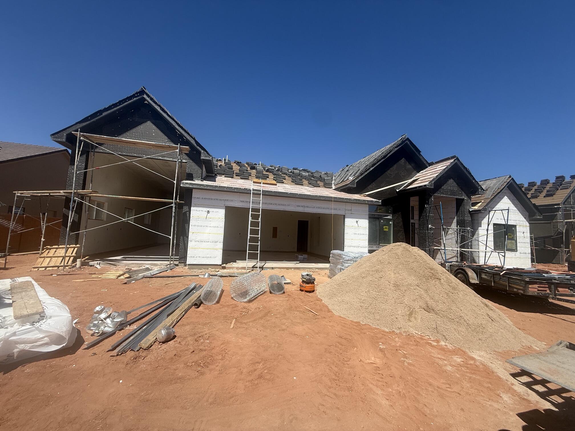 Gorgeous gable-style home: Large lot, giant slider in the great room, beautiful mountain views, epoxy garage floor, wired for surround in the great room, and a 37 ft deep RV garage with RV parking on the side, and a 20x40 pool. The floor plan is open and light with five bedrooms (one being a ''flex'' room with a seperate entrance). The finishes are high-quality and beautiful: stunning iron door, painted and knotty alder cabinets throughout, gorgeous countertops, GE CAFE appliances, and Delta plumbing fixtures. Close to hiking and biking trails.