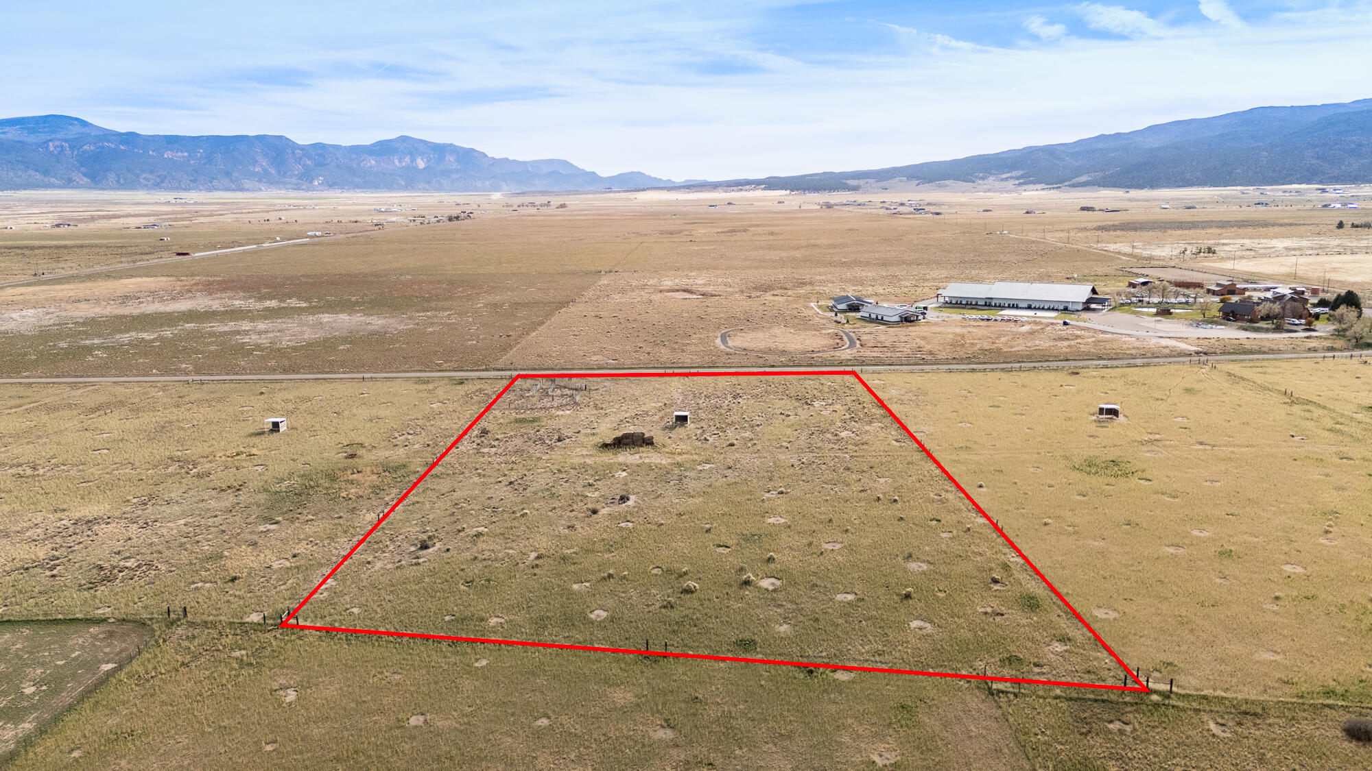 Discover open space and opportunity with this 5.09-acre parcel located near Lake Quichapa in Cedar City, Utah. Offering excellent access and recent area improvements—including chip-sealed main roads and a paved road ending at 7700 W—this property combines convenience with wide-open rural charm. The land is fully fenced and comes equipped with livestock waters and weather sheds, making it ideal for ranching, recreation, or future development. Enjoy sweeping views of the Kolob Mountains, creating a beautiful backdrop for your Southern Utah retreat or small ranch. This parcel is offered individually or the adjoining lot can be purchased, giving buyers the option to expand their acreage and possibilities. Adjoining property is 7886 W 2000 S. Power is not currently stubbed to the property but is located nearby (approximately at 8100 W or 7700 W). No water rights or shares are included. Buyer to verify all information. Whether you're looking for a peaceful getaway, livestock property, or long-term investment, this acreage delivers space, access, and views - all just a short drive from Cedar City.