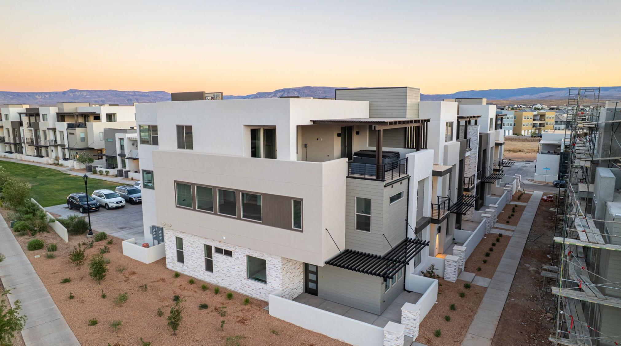 Discover the Pacific II, a standout in the acclaimed Desert Color community, offering 3,605 square feet of living space. With 5 bedrooms, 5.5 bathrooms, and a 1-car garage, this townhome boasts a gourmet kitchen, built-in banquette, and mini bar for the ultimate vacation. Bunk rooms ensure plenty of space for larger groups, while the second-floor deck, complete with a hot tub and fire table, provides the perfect spot to unwind after a day of adventure in Southern Utah.