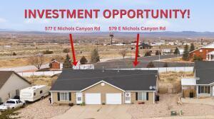 Investment opportunity with excellent income potential! Zoned Central Commercial, this duplex offers exceptional flexibility for investors. Each unit features 3 bedrooms, 2 bathrooms, 1,117 SF, and a 1-car garage. Built in 2005 on a .29-acre lot, the property has long-term month-to-month tenants and no vacancy in over 3 years. Current owners have prioritized reliable rental income, providing an opportunity for new owners to adjust rents to market rates if desired. Recent updates include vinyl plank flooring in the kitchens, bathrooms, and laundry areas, plus a refurbished roof. Xeriscape landscaping, a fenced backyard, and close proximity to parks, schools, shopping, and places of worship complete the package. **Adjacent Duplex with RV Garage Available.**