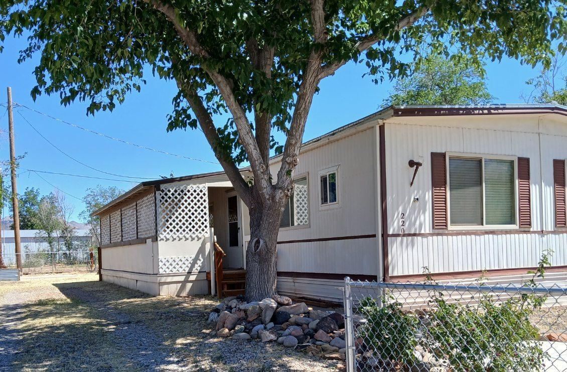 FRESHLY PAINTED!! Tucked away on an owned 0.14-acre lot, this double-wide manufactured home is in great shape and has been lovingly maintained. It comes fully loaded with all appliances, including the washer and dryer, so you can move in and start living, not shopping. Step outside to enjoy nice views, a fully fenced yard, oversized porches made for morning coffee and sunset wind-downs, plus RV parking and a detached two-car garage for all the toys, tools, and weekend plans.
Low utilities keep things practical, and the location keeps life easy, with amenities within walking distance. When you want to play, you're about 20 minutes from Springdale and Zion National Park, and around 20 minutes to Quail Creek and Sand Hollow State Parks. This one checks the boxes and brings the lifestyle.