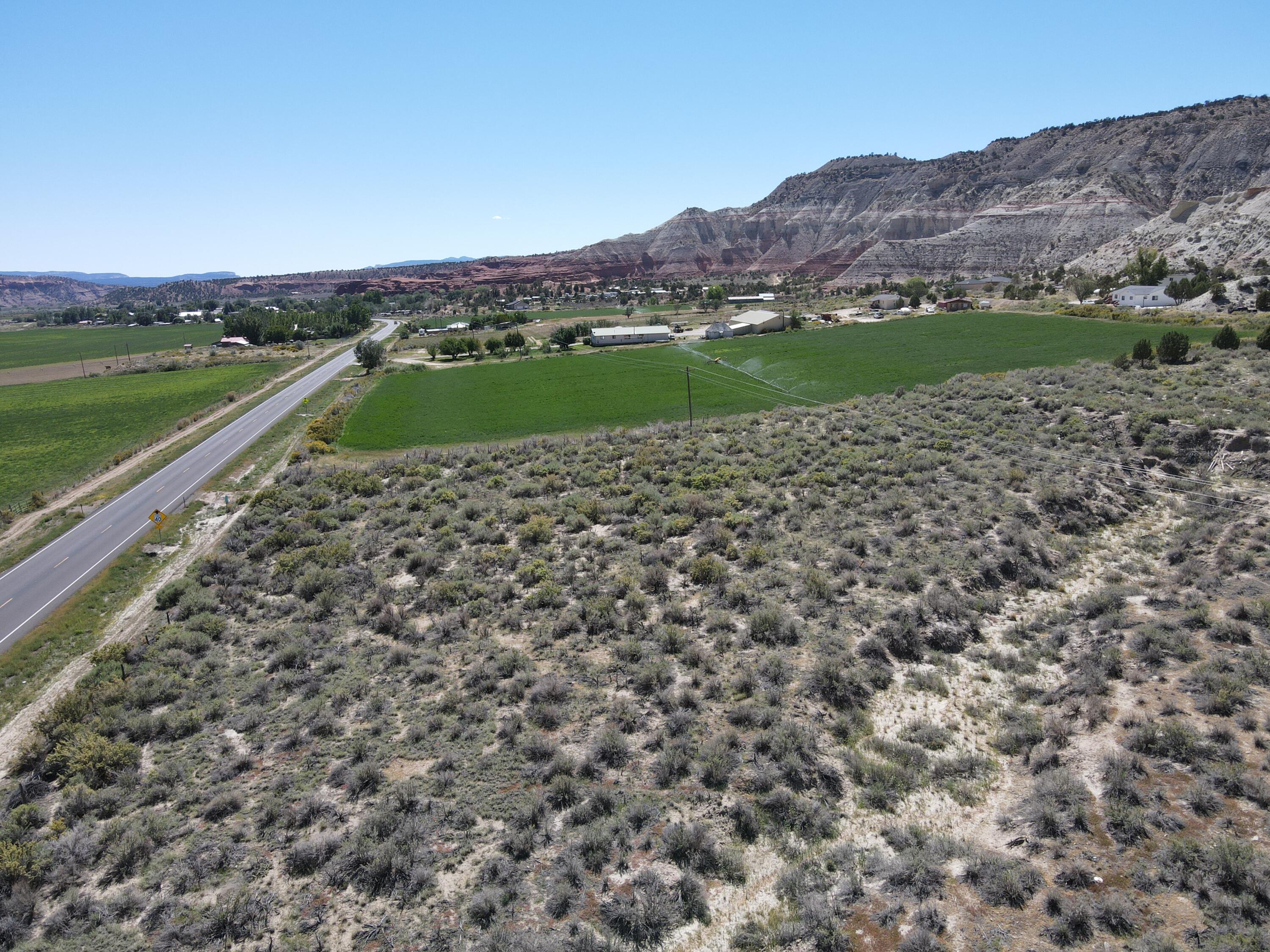 Highway 12 property just 15 minutes from Bryce Canyon National Park! Located in the beautiful little town of Cannonville, this 9+ acre parcel has tons of potential uses. Currently zoned agricultural but could be used for residential, developed into a small subdivision, or be used for a commercial venture with the approval of a zone change.