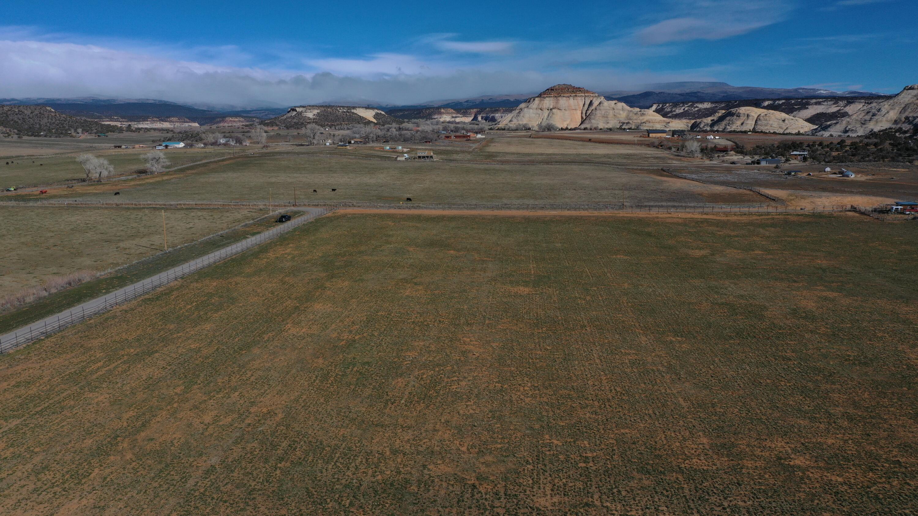 Longing for the quiet of rural living? Don't wait!
Beautiful lot with views, located in the stunning Lower Boulder Valley, in the quaint town of Boulder, Utah. This lot offers amazing views in every direction, including the iconic Sugarloaf to the north and the Grand Staircase- Escalante Monument to the east and south.

Culinary water in street and hook up fees paid with city.
Power in street.
Fiber optic in street

This is one of two amazing lots. An additional 2.78 acres lot directly to the east can be purchased for $234,000. Sellers are willing to work with buyer of both parcels to make lot line adjustments for a full 6 acres in order to qualify for greenbelt. .