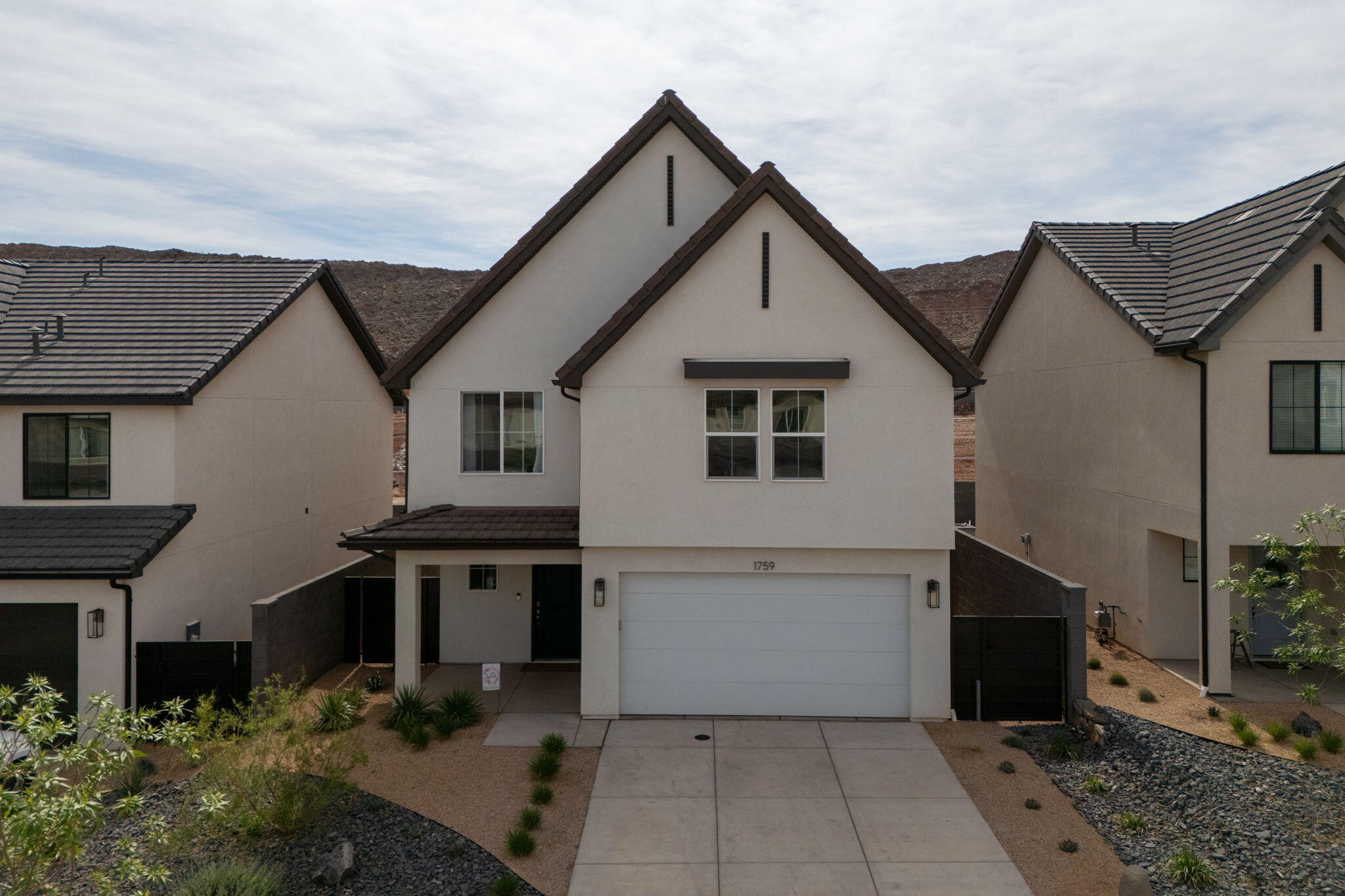 Bright and beautifully upgraded, this four-bedroom 2.5-bath home shows like a model. The kitchen includes a large island, farmhouse sink, pantry, and ceiling-height cabinets with crown molding. Downstairs living room offers an electric fireplace with custom built-in cabinetry. The primary suite includes its own fireplace and wood mantle. Enjoy a covered patio with Mountain Views great for entertaining. The yard has the perfect spot for fire pit or hot tub with room to garden or a play area for kids and or pets all closed in by side gates. This home is move-in-ready! Home is able to be sold fully furnished.