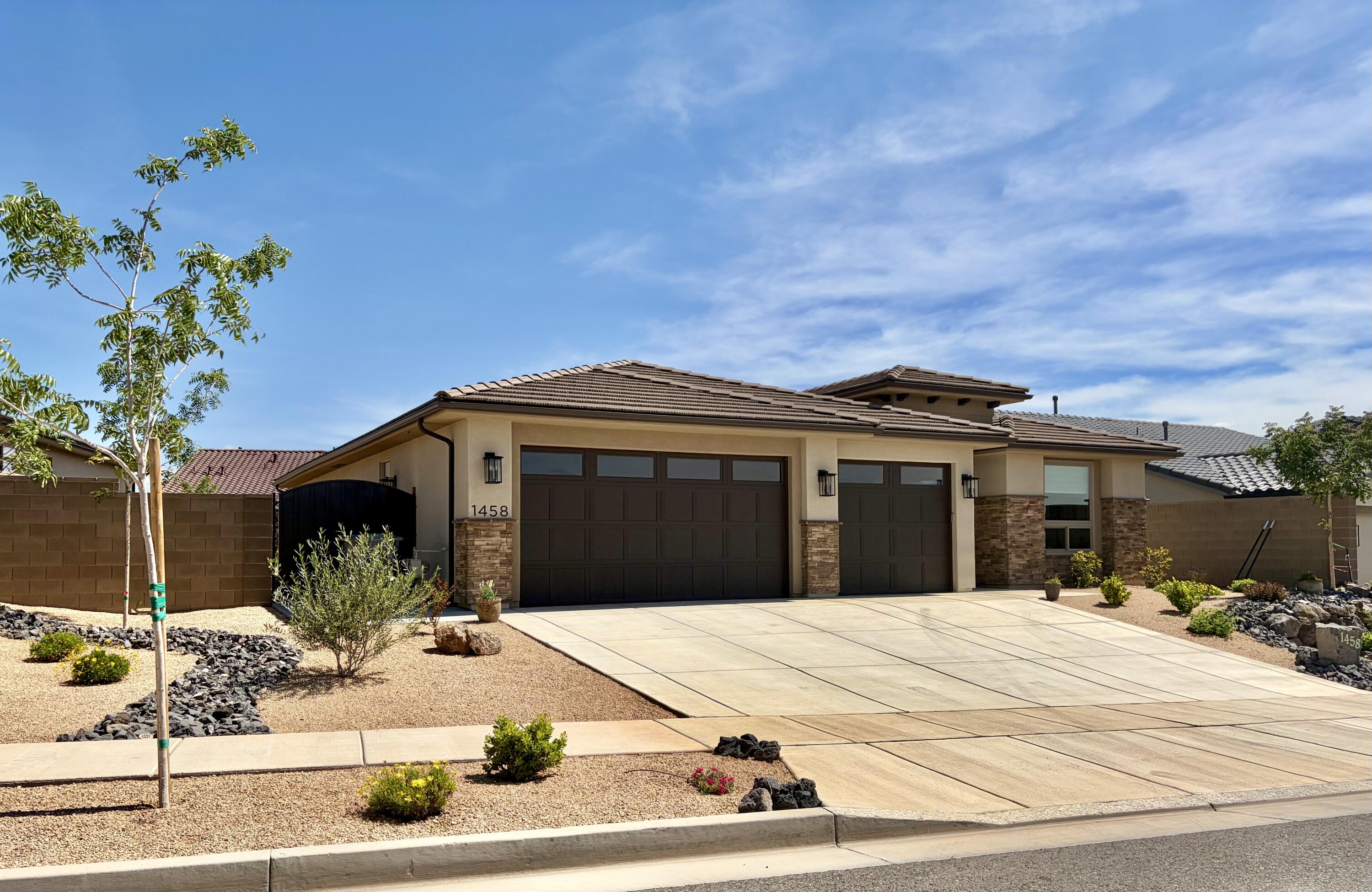 Tucked into the highly sought-after Solis development within Coral Canyon in Washington, this beautifully upgraded home at 1458 N Highland Parkway offers the perfect blend of comfort, style, and effortless desert living.

**Extra large / deep garage - back part can be converted into a 4th bedroom!

With over $100,000 in thoughtful upgrades, every detail has been carefully curated to elevate both function and design. Step inside and immediately notice the abundance of natural light streaming through brand-new, high-quality Andersen windows, complemented by custom window shades and stylish ceiling fans throughout the home.

The heart of the home flows seamlessly into a backyard retreat designed for relaxation and entertaining. Enjoy stunning views of Pine Mountain while unwinding under the charming gazebo with covered seating for four. The professionally designed xeriscaped front and backyards offer beauty without the upkeep, enhanced by a tranquil water feature that creates a peaceful outdoor ambiance. A custom metal gate fully encloses the yard, adding both privacy and convenience.

Inside, you'll find elevated touches where they matter most--custom cabinetry in the hallway and laundry room, a new soft water system, and reverse osmosis filtration in the kitchen for clean, fresh drinking water.

Living in Solis means enjoying exceptional community amenities, including a clubhouse, pickleball courts, swimming pool, spa, and discounted access to the Coral Canyon Golf Course.

This home isn't just move-in ready--it's lifestyle ready. Whether you're enjoying quiet mornings with mountain views or hosting evenings in your private outdoor oasis, this property delivers the perfect Southern Utah experience.