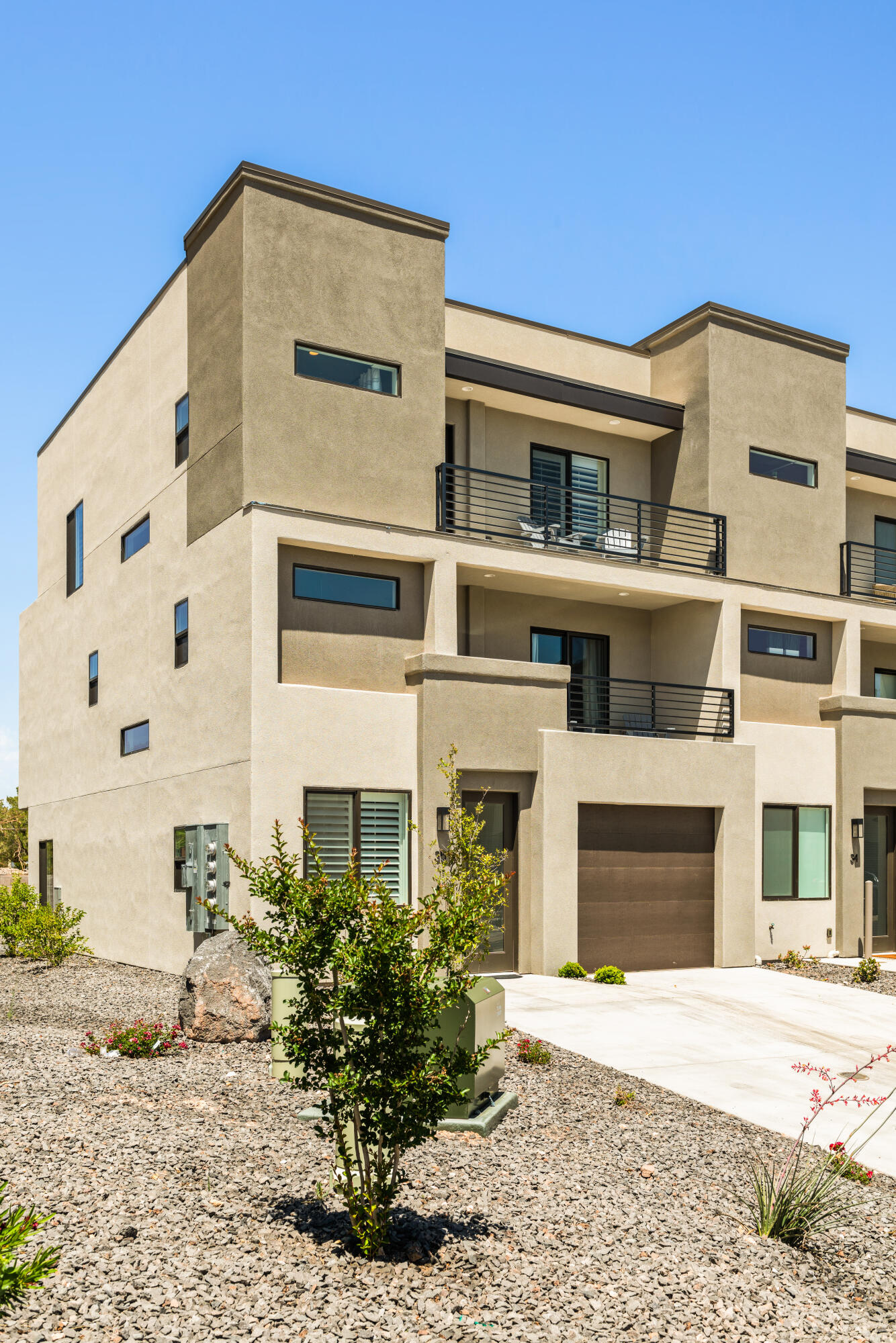 Welcome to your luxury Southern Utah getaway and income-producing investment all in one. Located in the highly sought-after Vue at Green Valley community, this fully furnished, nightly rental-approved townhome offers the perfect blend of modern comfort, resort-style amenities, and exceptional rental potential.

Designed for both unforgettable family vacations and strong investment performance, this spacious 5-bedroom, 4.5-bath retreat features multiple gathering spaces, beautifully appointed finishes, and accommodations for large groups. Guests and owners alike will appreciate the open-concept living area, gourmet kitchen with quartz countertops, generous dining space, and private balconies perfect for enjoying St. George's stunning desert landscapes and mountain views.

With three private suites featuring attached bathrooms, this property comfortably accommodates multiple families while maintaining privacy and convenience. Whether you're relaxing after a day on the golf course, exploring nearby Zion National Park, or enjoying the area's endless outdoor recreation, this home serves as the perfect home base.

The Vue at Green Valley offers an outstanding amenity package including a resort-style swimming pool, oversized hot tub, pickleball courts, basketball court, playground areas, and beautifully maintained grounds. Located minutes from golf courses, dining, shopping, hiking, Sand Hollow Reservoir, and some of Southern Utah's most iconic attractions.

Whether you're searching for a proven vacation rental, a second home, or a combination of both, this turnkey property is ready to generate income from day one while providing years of unforgettable memories for family and friends.