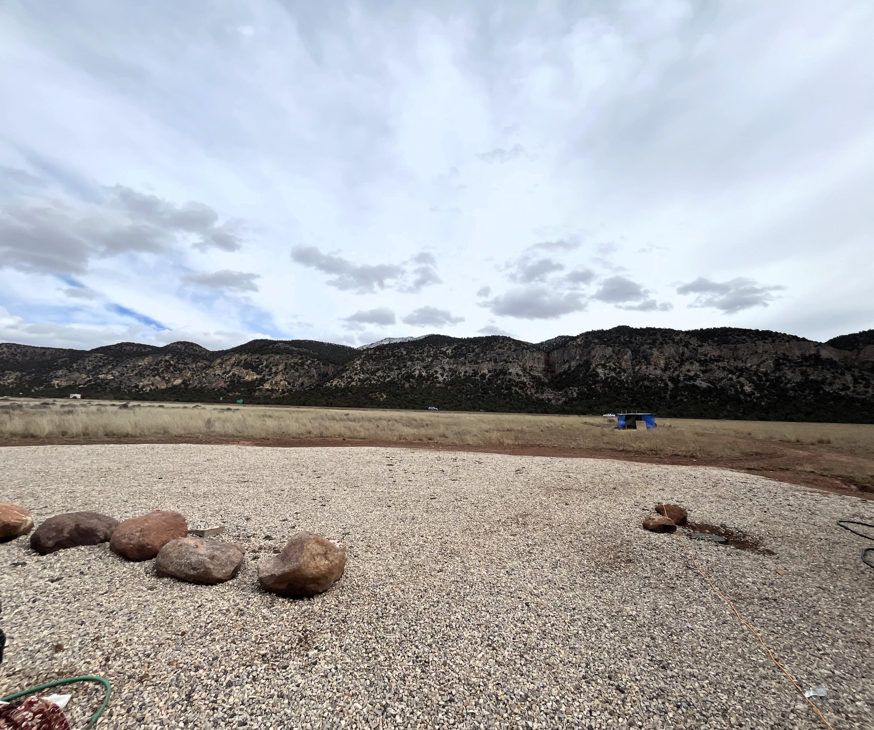 Don't miss this great opportunity to own 5.32 acres featuring sweeping views in every direction! This versatile property is ready to go, with power, water, and septic already connected and available on the lot making it ideal for building your dream home or getaway. Conveniently located between St. George and Cedar City, you're just about a 20 to 25 minute drive either way for shopping, dining, and entertainment, plus easy access to the freeway nearby. There's plenty of space to spread out and enjoy the wide-open surroundings and incredible views. Please note: All non-permanent structures on property NOT INCLUDED IN SALE.
