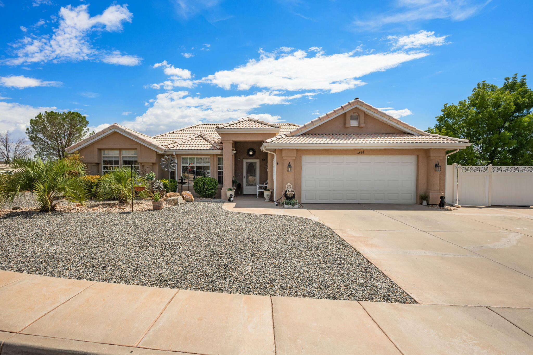 Welcome home to this beautiful home situated on a generous 0.24-acre lot with RV parking and NO HOA. Thoughtfully updated and move-in ready, this home features new wood flooring throughout the den, living room, and hallway, along with new carpet and blinds in the spacious primary suite and new carpet in a secondary bedroom. The open-concept floor plan offers vaulted ceilings, abundant natural light, and inviting living spaces. The kitchen is complete with granite countertops, a center island, double ovens, stainless steel appliances, and ample cabinetry. The primary suite includes a walk-in closet, dual vanities, a jetted soaking tub, and separate shower. Enjoy a new water heater, serviced water softener with new resin, new garbage disposal, and a new electrical subpanel in the garage. The garage has also been freshly painted and includes additional storage cabinets. Washer and dryer are included. Step outside to the oversized covered patio overlooking a private, low-maintenance backyard complete with mature landscaping and a storage shed. Conveniently located near parks, schools, shopping, and dining, this home offers the perfect combination of comfort, functionality, and flexibility.