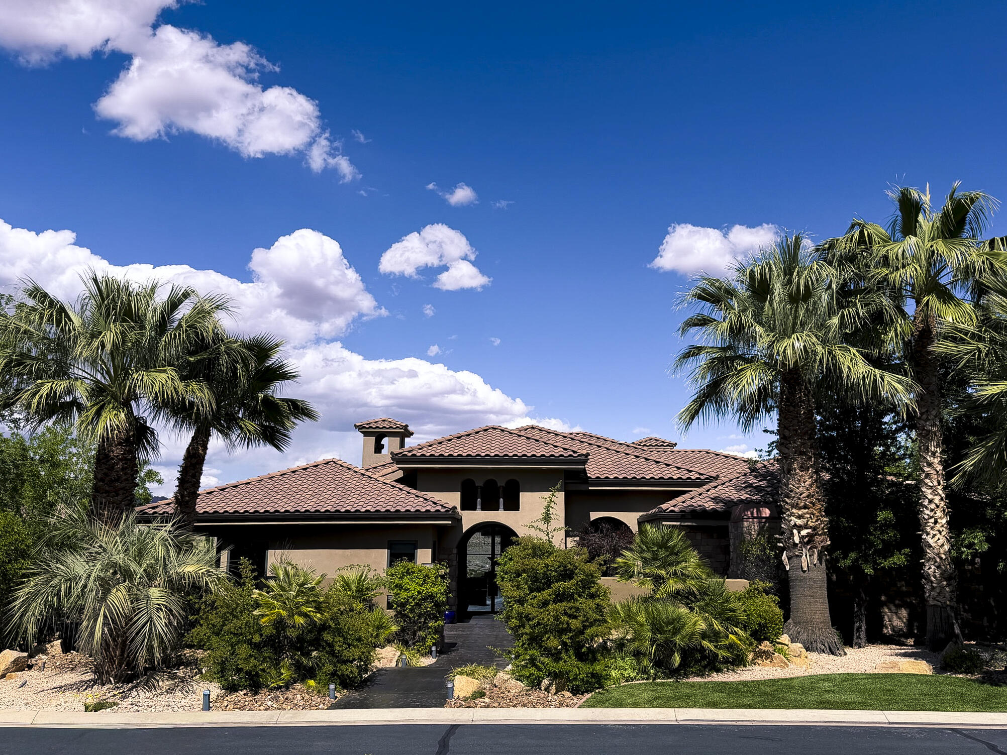 Experience one of Northbridge Estates' most distinctive luxury homes, where breathtaking Pine Valley Mountain views are showcased through dramatic floor-to-ceiling windows that create an unforgettable first impression. Thoughtfully updated throughout, this exceptional residence offers over 10,000 square feet designed for both everyday living and effortless entertaining.

The resort-style backyard features a sparkling pool with slide, pickleball court, trampoline, playground, and inviting gathering spaces perfect for making lasting memories. Inside, enjoy a private movie theater, multiple living areas, and a comfortable casita with its own laundry and jacuzzi tub.

The luxurious primary suite is a true retreat, complete with a private view deck, hot tub, fireplace, TV, and spa-inspired bath.

Whether entertaining guests, accommodating extended family, or simply enjoying Southern Utah's incredible lifestyle, this remarkable home offers an exceptional blend of luxury, recreation, privacy, and unforgettable views in one of St. George's most sought-after neighborhoods. Priced below recent appraised value, this is an exceptional opportunity in today's luxury market.

Owner/Agent. Square footage figures are provided as a courtesy estimate only. Buyer is advised to obtain an independent measurement.