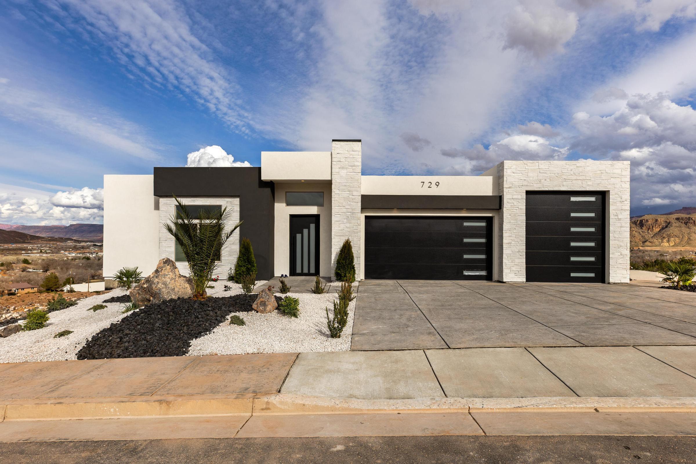Experience elevated desert living in this exceptional new construction home in the highly sought-after Hillside Estates, offering unobstructed panoramic views of Zion, Pine Valley Mountain, the Hurricane Valley, Kolob Mountain, and the surrounding plateaus. Designed to capture the beauty of Southern Utah from nearly every angle, this 5-bedroom, 5-bath residence seamlessly blends luxury, comfort, and resort-style living.

The gourmet kitchen is a chef's dream, featuring premium Café appliances, custom cabinetry, and an expansive butler's pantry designed for effortless entertaining and everyday convenience. Expansive windows flood the home with natural light while showcasing the breathtaking landscape beyond. Thoughtfully designed for both relaxation and gathering, the home offers two spacious living areas, including a walkout lower-level family room with a kitchenette that opens directly to the outdoor entertaining space, making it ideal for hosting guests, poolside gatherings, or multi-generational living.

Step outside to your private backyard retreat complete with a sparkling pool, hot tub, and dedicated pool bath, all set against one of the most spectacular view corridors in Southern Utah. An elevated deck provides the perfect setting for morning coffee, sunset dinners, and evenings spent taking in the endless mountain and valley vistas.
Additional highlights include an oversized RV garage with ample space for recreational vehicles, boats, toys, and adventure gear. More than just a home, this remarkable Hillside Estates property offers a private luxury retreat where unmatched views, exceptional design, and the Southern Utah lifestyle come together in perfect harmony.