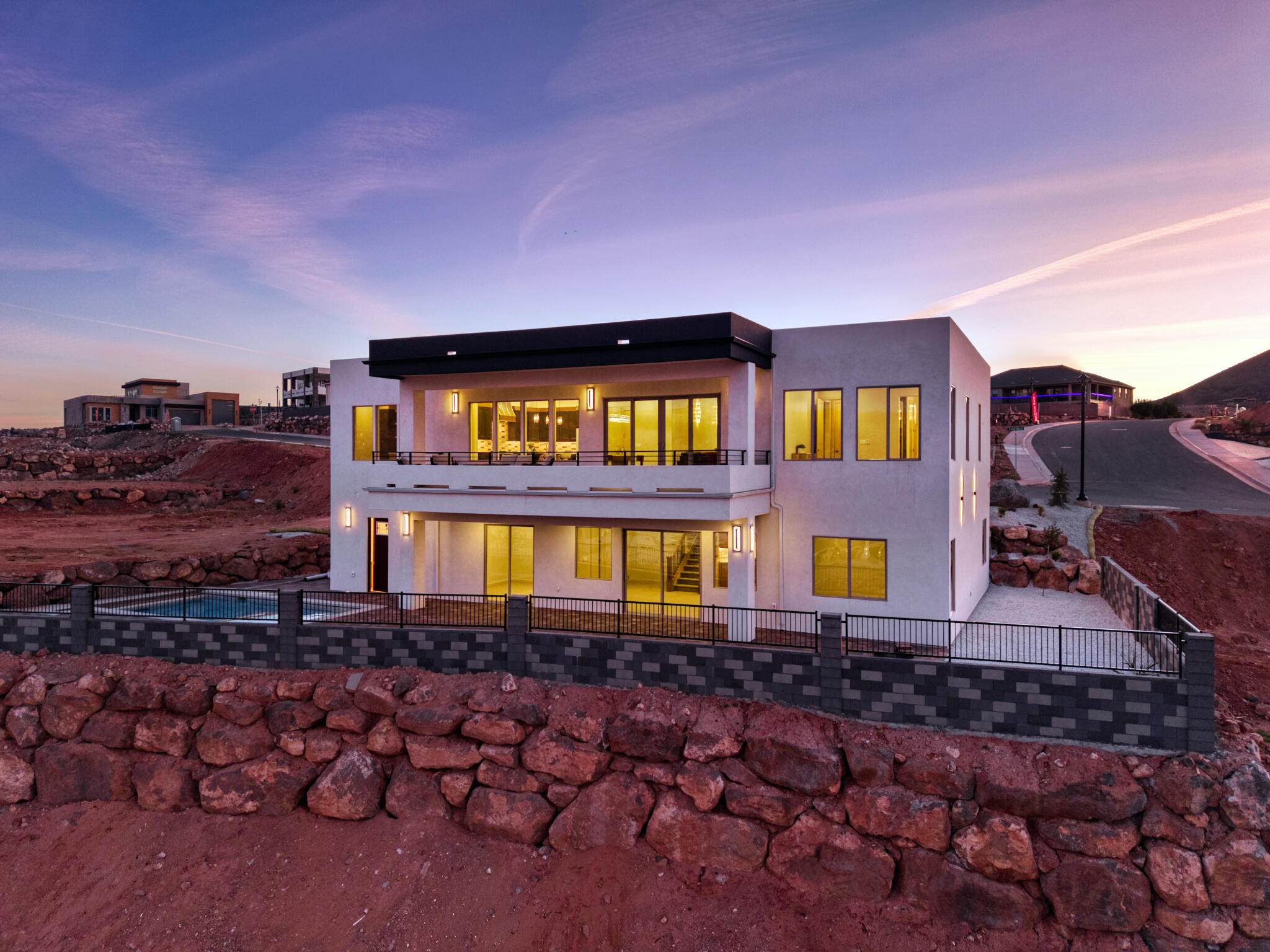 Experience elevated desert living in this exceptional new construction home in the highly sought-after Hillside Estates, offering unobstructed panoramic views of Zion, Pine Valley Mountain, the Hurricane Valley, Kolob Mountain, and the surrounding plateaus. Designed to capture the beauty of Southern Utah from nearly every angle, this 5-bedroom, 5-bath residence seamlessly blends luxury, comfort, and resort-style living.

The gourmet kitchen is a chef's dream, featuring premium Café appliances, custom cabinetry, and an expansive butler's pantry designed for effortless entertaining and everyday convenience. Expansive windows flood the home with natural light while showcasing the breathtaking landscape beyond. Thoughtfully designed for both relaxation and gathering, the home offers two spacious living areas, including a walkout lower-level family room with a kitchenette that opens directly to the outdoor entertaining space, making it ideal for hosting guests, poolside gatherings, or multi-generational living.

Step outside to your private backyard retreat complete with a sparkling pool, hot tub, and dedicated pool bath, all set against one of the most spectacular view corridors in Southern Utah. An elevated deck provides the perfect setting for morning coffee, sunset dinners, and evenings spent taking in the endless mountain and valley vistas.
Additional highlights include an oversized RV garage with ample space for recreational vehicles, boats, toys, and adventure gear. More than just a home, this remarkable Hillside Estates property offers a private luxury retreat where unmatched views, exceptional design, and the Southern Utah lifestyle come together in perfect harmony.