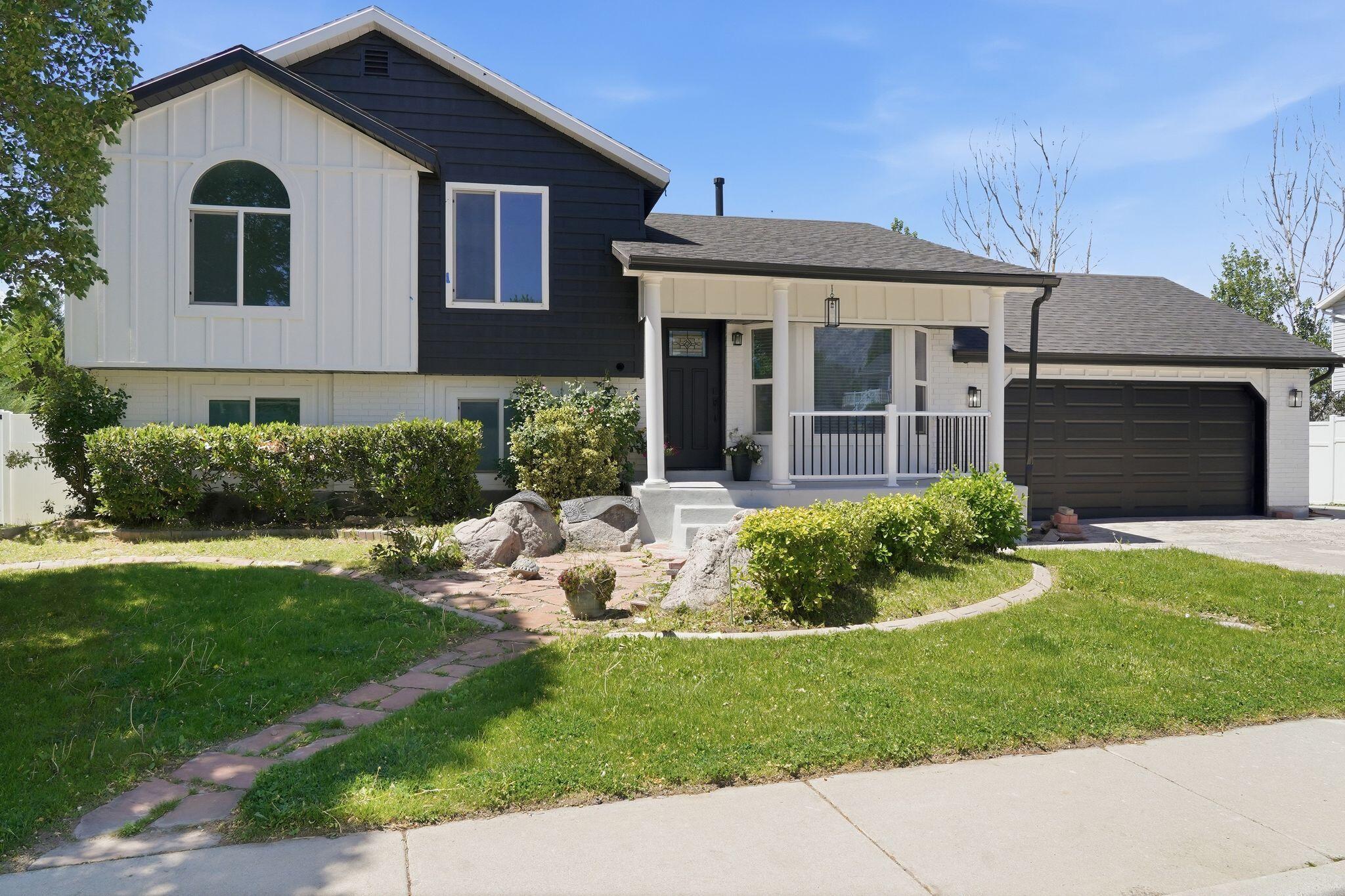 Beautifully updated home offering the perfect blend of comfort, style, and space. The bright, open layout features a remodeled kitchen with white cabinetry, stainless steel appliances, subway tile backsplash, and generous prep space flowing into the main living areas. Step outside to the expansive deck overlooking the large backyard with mature trees, open green space, and plenty of room to play or entertain. The spacious lower-level family room provides additional gathering space with abundant natural light and flexible living options. Complete with charming curb appeal, updated finishes, and a two-car garage, this home combines peaceful surroundings with convenient access to shopping, dining, and commuter routes.