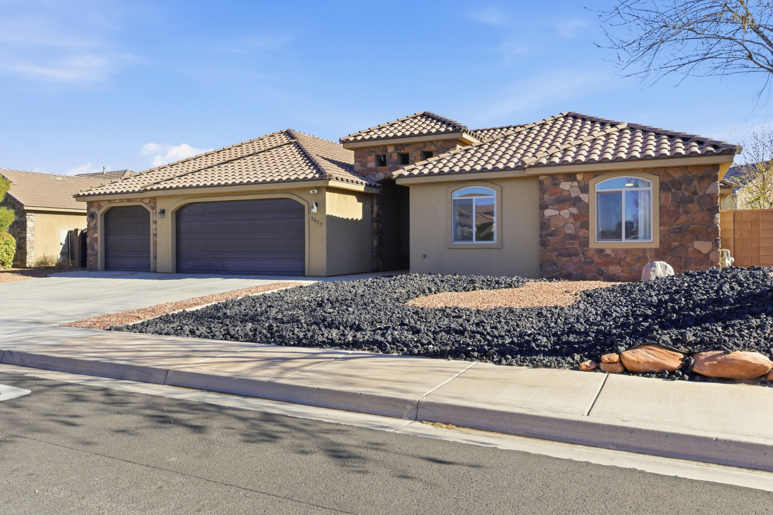 This beautifully upgraded 5-bedroom, 3.5-bath home features two spacious master suites, zoned air conditioning, brand-new carpet throughout, and modern touches at every turn. The custom built-in entertainment center, oversized pantry, and functional open layout make this home both luxurious and practical. Step outside to your private backyard complete with a low-maintenance pool and hot tub, mature fruit trees, RV parking, a 3-car garage, and views of Pine Valley and Zion. Located in the highly desirable Dixie Springs community with natural gas, this home is just minutes from Sand Hollow and Quail Creek Reservoirs, premier golf courses including Coral Canyon, Sky Mountain, and Sand Hollow, plus world-class mountain biking and ATV trails.