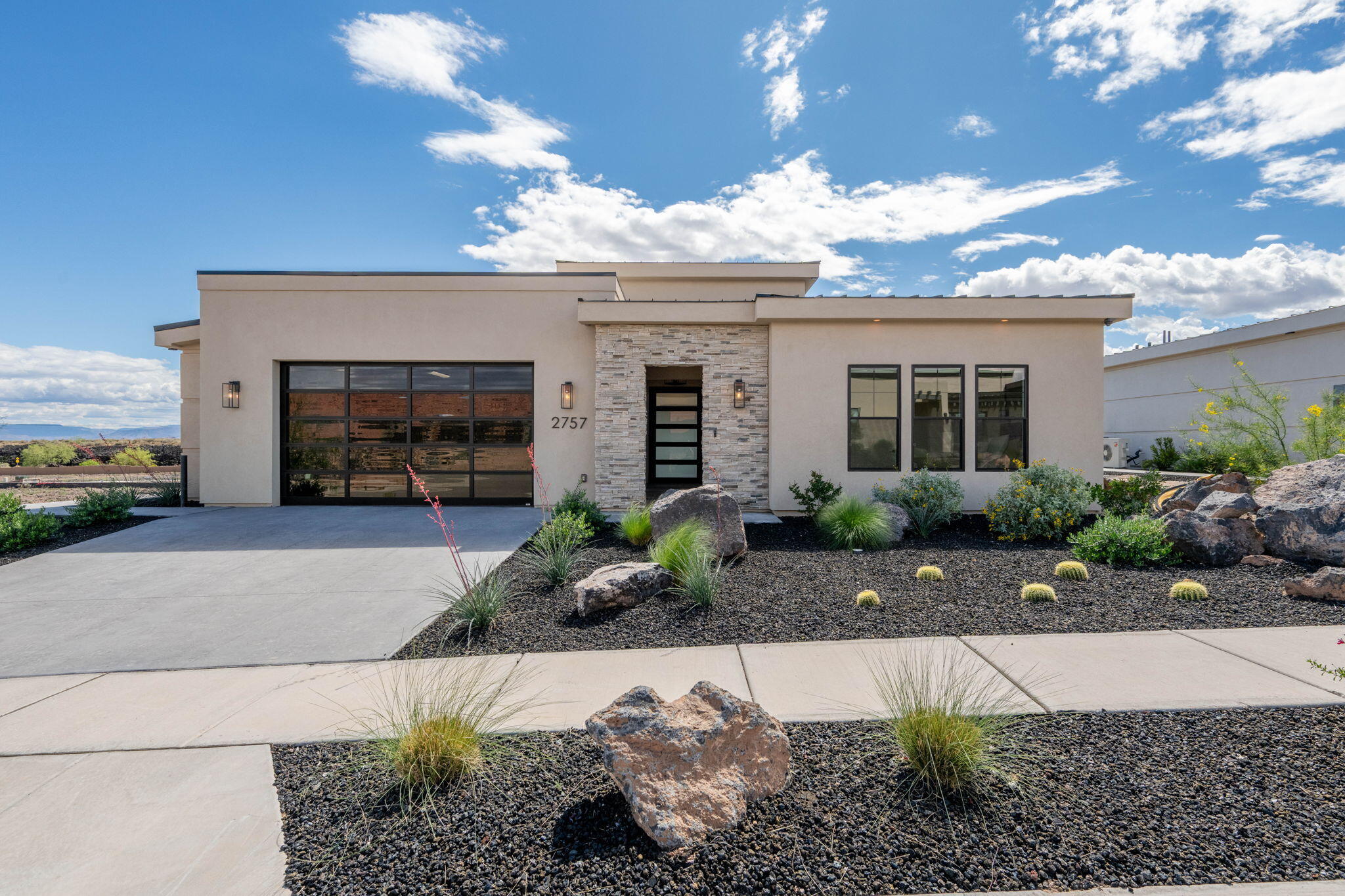 Discover refined desert living in the exclusive Points at Snow Canyon, Southern Utah's newest 55+ community designed to redefine retirement. This residence showcases the highly sought-after Blackridge floor plan, offering 3 bedrooms, 3 bathrooms, a versatile flex room, and a spacious two-car garage. Thoughtfully designed with modern architecture and upscale finishes, the home includes smart home technology, custom interiors, and a chef-inspired kitchen complete with premium tile work, custom cabinetry, and top-of-the-line Sub-Zero and Wolf appliances. Residents enjoy a low-maintenance lifestyle surrounded by breathtaking scenery and close proximity to Utah's renowned state and national parks, along with endless opportunities for outdoor recreation. Community amenities elevate everyday living and include an 18-hole championship putting course, pickleball and bocce courts, a saltwater pool and jacuzzi, golf simulator, salon and spa, multiple dining venues, and a vibrant calendar of social events and programming. Select services such as housekeeping and food delivery are also available, with some amenities offered through an optional monthly membership. Experience a lifestyle designed for connection, comfort, and adventure--this is more than a home, it's the next chapter done right.