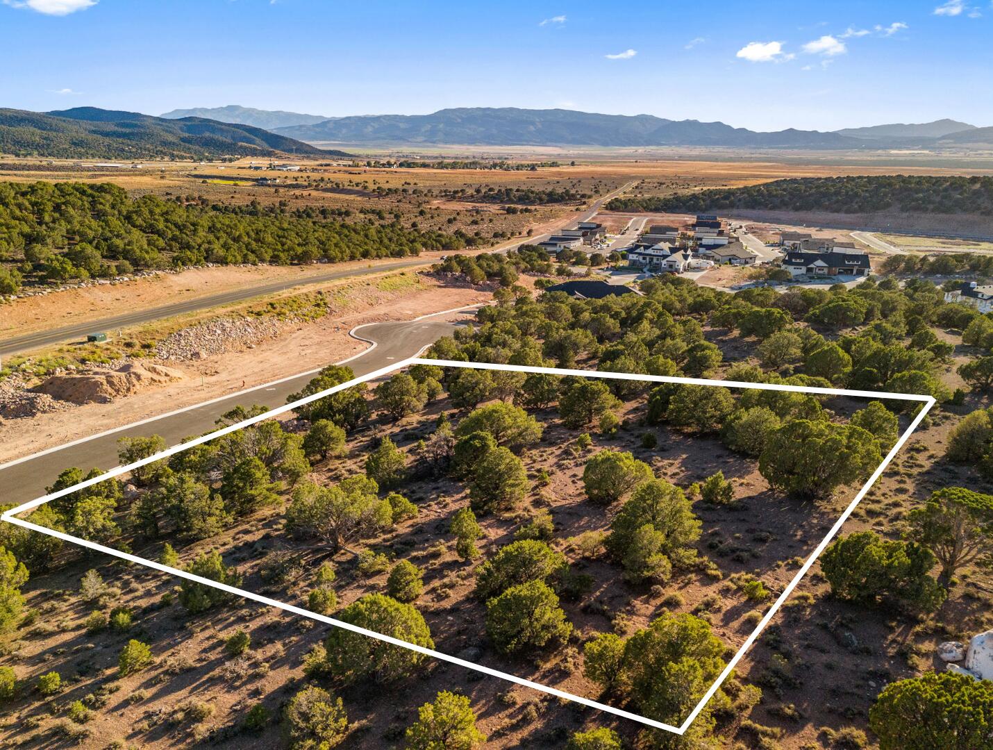 This is Lot Number 12, a .67-acre homesite located in the highly sought-after Estates at South Mountain subdivision. Enjoy stunning views of Shurtz Canyon and the surrounding Southern Utah mountains. This growing community is positioned near planned future elementary, middle, and high schools, adding long-term value and convenience. Bring your own builder or choose to build with the South Mountain Development Group. Don't miss this opportunity to secure a premium lot in one of Cedar City's most desirable neighborhoods. No HOA.