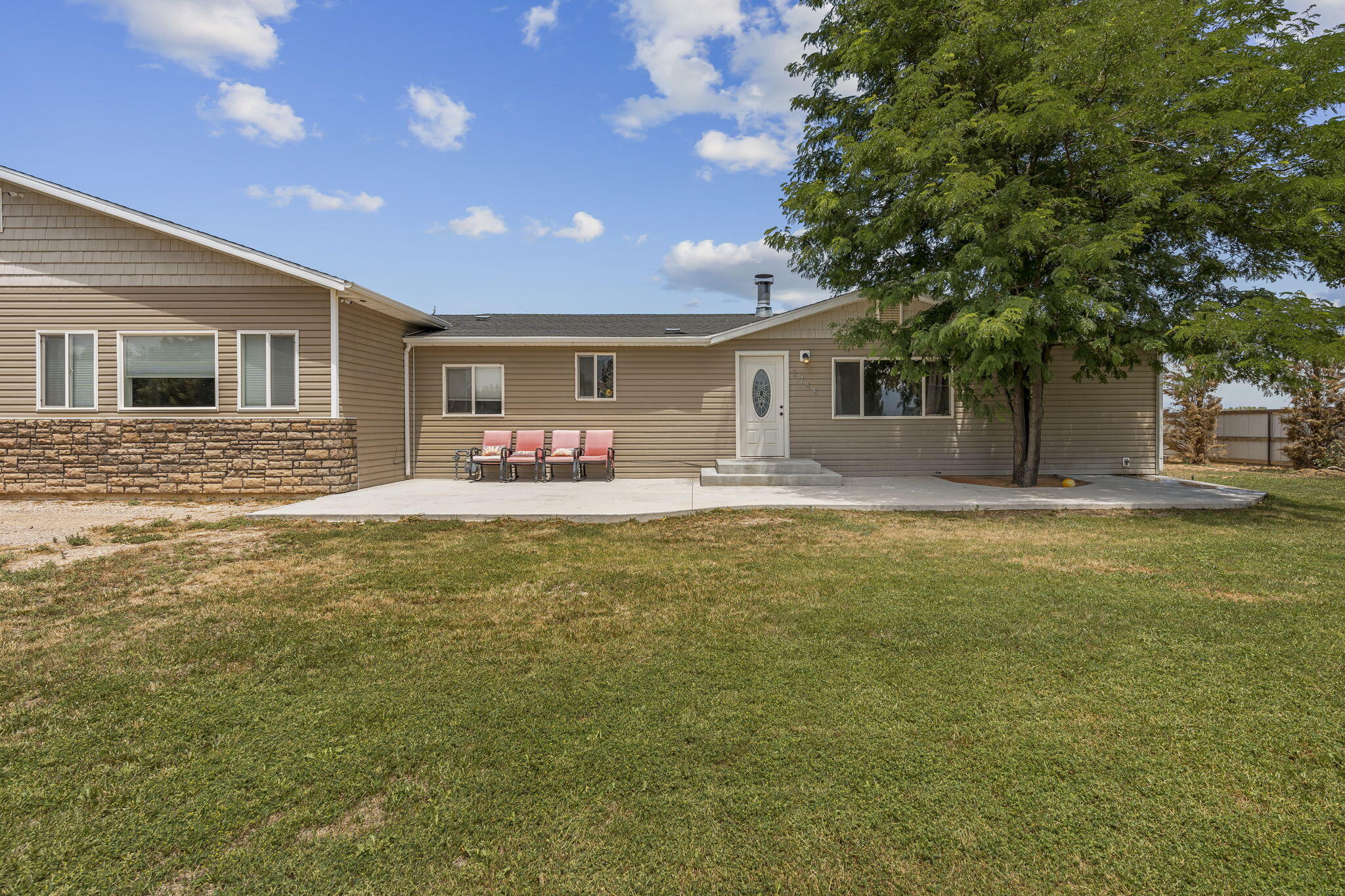 Discover the perfect blend of space, comfort, and country living in this beautifully updated 5-bedroom, 4-bathroom home, all on one level. Situated on just over half an acre, this property offers RV parking, animal rights, and a peaceful rural setting. Inside, you'll find a spacious, thoughtfully designed floor plan featuring two separate living areas, providing plenty of room for relaxing, entertaining, or accommodating a growing household. Recent renovations add modern touches while maintaining the home's inviting character. Step outside to enjoy the fully fenced yard, complete with mature trees that provide shade, privacy, and a picturesque setting. A detached one-car garage/workshop offers additional storage or workspace for hobbies and projects. If you're looking for room to spread out, enjoy the outdoors, and experience the charm of country living with all the conveniences of a spacious, updated home, this property is a must-see!