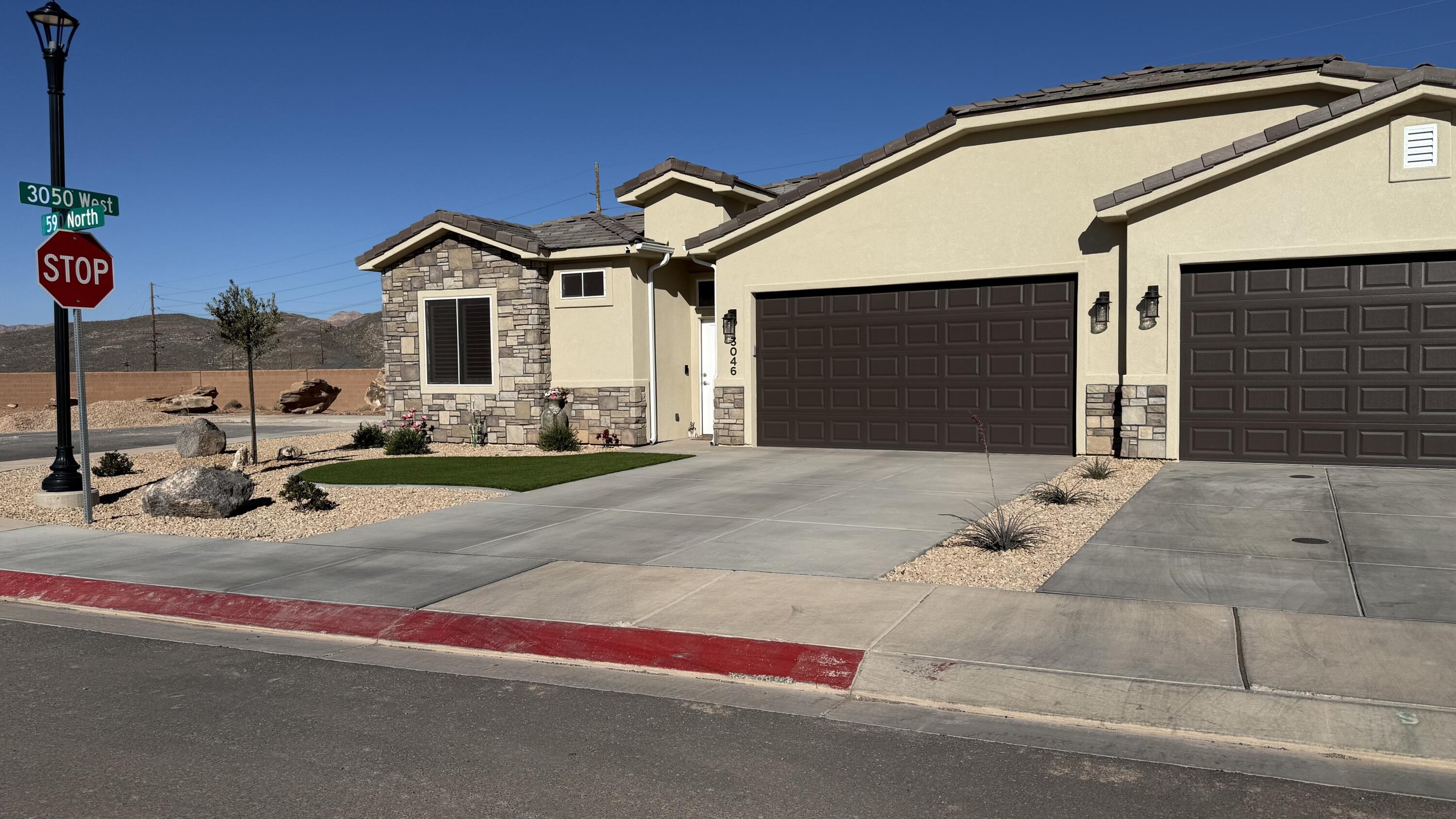 This nearly new home is move-in ready! One of the few single story townhomes in the area, this home has many high-end features including porcelain wood-grain tile floors, 10' ceilings, fully tiled walk-in shower with a glass enclosure, stained hardwood cabinets with soft close hinges and under cabinet lighting, quartz counter tops throughout, two-toned paint  for extra style, fully finished garage, covered patio, block wall and fully landscaped backyard with turf, top notch plumbing fixtures, home has aesthetically pleasing synthetic energy efficient stucco and stone exterior with super-durable concrete-tile roof! Plus RV parking! . HOME BEING SOLD TURN KEY, WITH THE EXCEPTION OF THE WALL ART
