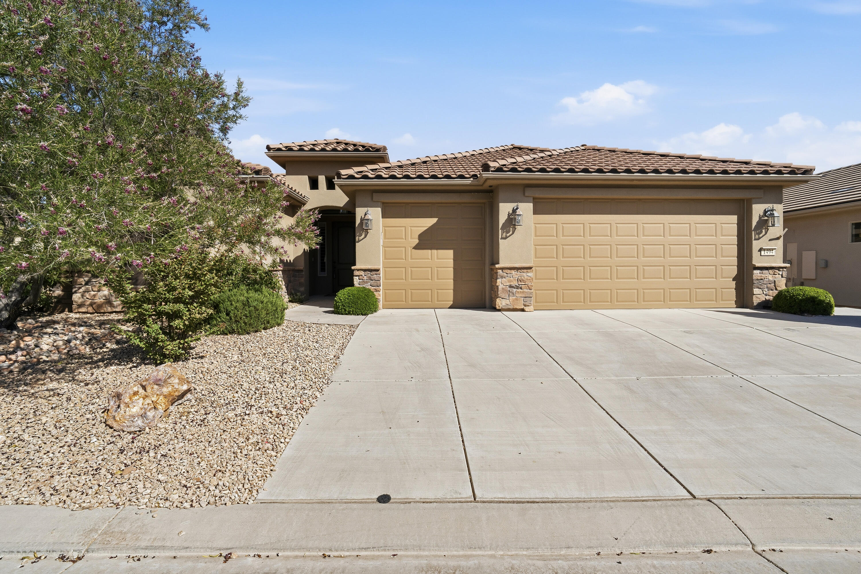 Welcome to this beautifully maintained 3-bedroom, 3-bathroom home with a dedicated den, located in the highly sought-after SunRiver active adult community. Offering 2,066 square feet of thoughtfully designed living space, this home combines comfort, elegance, and low-maintenance living.

Step inside to discover tile flooring throughout, creating a clean and timeless look that is both stylish and easy to maintain. Multiple skylights fill the home with natural light, while plantation wood shutter blinds throughout add charm, privacy, and energy efficiency. The spacious floor plan features generously sized bedrooms, walk-in closets, and a versatile den that is perfect for a home office, hobby room, library, or guest space. The Medallion floor plan offers exceptional livability with spacious rooms, an open-concept design, and an abundance of storage throughout the home, ensuring plenty of space for organization and everyday convenience.

The open-concept living and dining areas flow seamlessly into the kitchen, making this home ideal for entertaining and everyday living. The spacious primary suite serves as a private retreat with a large walk-in closet and well-appointed en-suite bath.

Outside, enjoy a beautifully finished, low-maintenance backyard designed for relaxation and enjoyment. Outdoor sun shades provide additional comfort, while the tranquil waterfall feature creates a peaceful outdoor oasis perfect for morning coffee or evening gatherings. As an added bonus, the sale includes a golf cart, making it easy to take advantage of SunRiver's exceptional amenities and golf course lifestyle. An additional refrigerator and freezer are also included, providing extra storage and convenience.

Located within the desirable SunRiver community, residents enjoy access to championship golf, fitness facilities, walking trails, pickleball, social clubs, and a vibrant active-adult lifestyle. This move-in-ready home offers the perfect blend of comfort, functionality, and resort-style living.