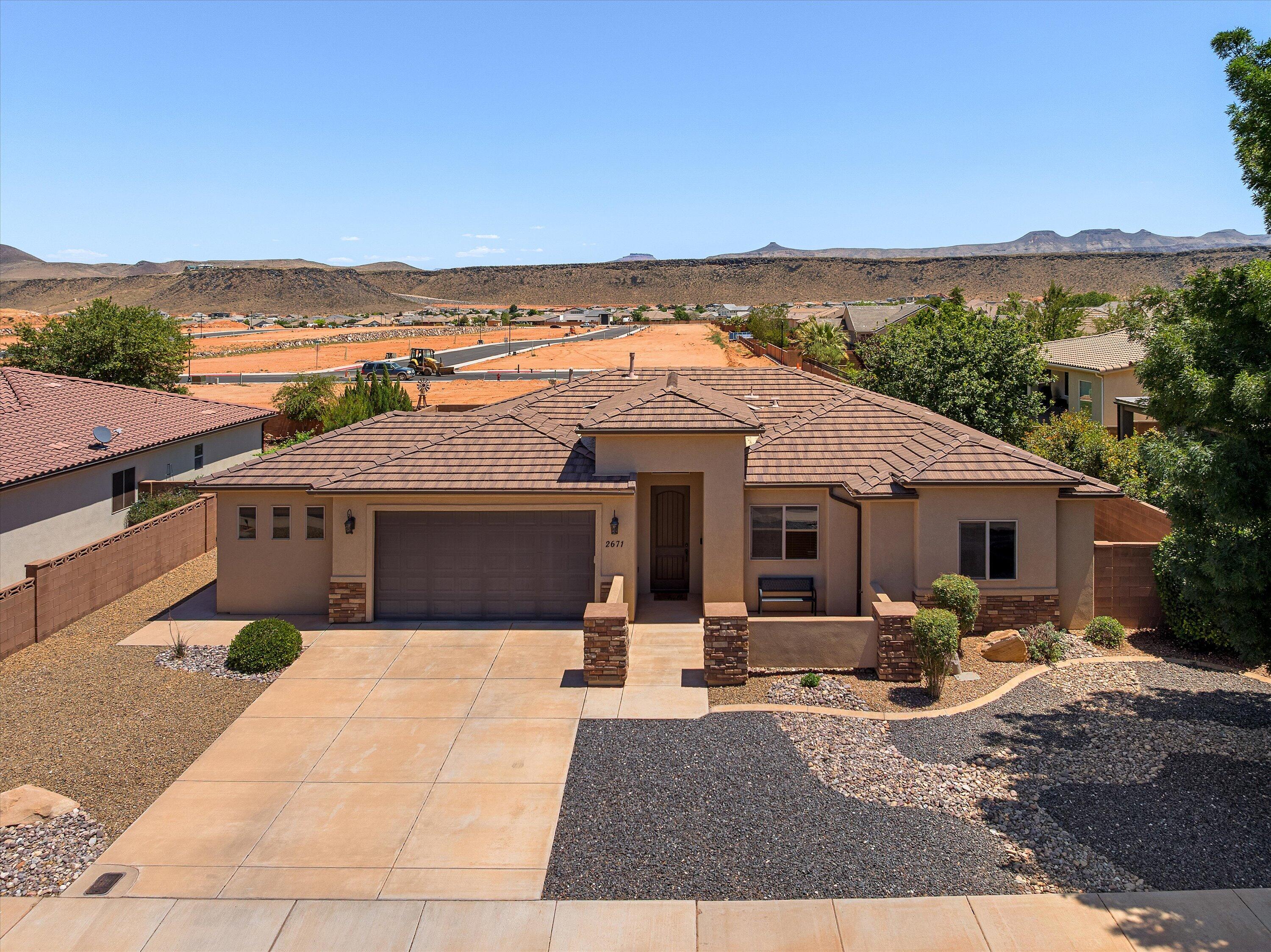 Under contract/contingent, seller is still reviewing offers. Current offer is subject to sale with a time clause addendum in place. Submit your offer today. Located in Dixie Springs near Sand Hollow & Quail Creek Reservoirs, Sand Hollow Golf Course, & Zion National Park, this well-maintained 2011 home offers the perfect blend of comfort & outdoor recreation. Featuring 1,824 sqft, 4 bed, 2 bath, 2-car garage, plus bonus office/flex room off the garage tied into HVAC. Open layout w/ abundant natural light, gas fireplace, granite countertops, corner pantry, tile/carpet flooring, & living room office nook. Primary suite features tiled separate tub/shower, jetted tub, & walk-in closet. Large 0.23-acre lot with fully fenced brick wall fencing. No HOA. Dixie Power.