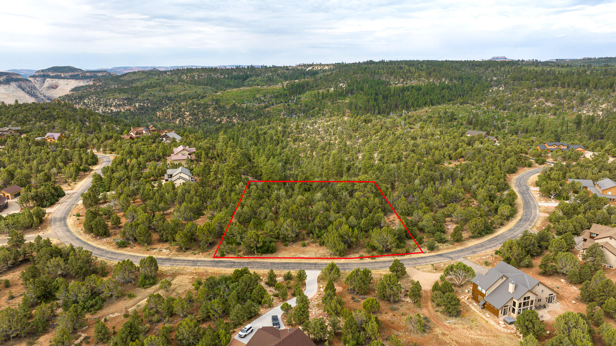 Turn your dream property into a profitable getaway! This 1.17-acre homesite in a private, gated community is approved for nightly rentals, offering an incredible opportunity to maximize your investment. Buy now and be ready to build by spring to start generating income in one of Southern Utah's most sought-after locations. Surrounded by upscale custom homes and breathtaking views, this lot comes with power and water at the property line, making it ready for your dream vacation rental or luxury retreat. Just minutes from Zion National Park and directly connected through the back entrance to the Zion Ponderosa Ranch Resort, you'll enjoy convenient access to pools, guided adventures, dining, and resort-style amenities. Capitalize on the booming short-term rental market while enjoying the privacy, convenience, and adventure that come with owning in this prime Southern Utah location.