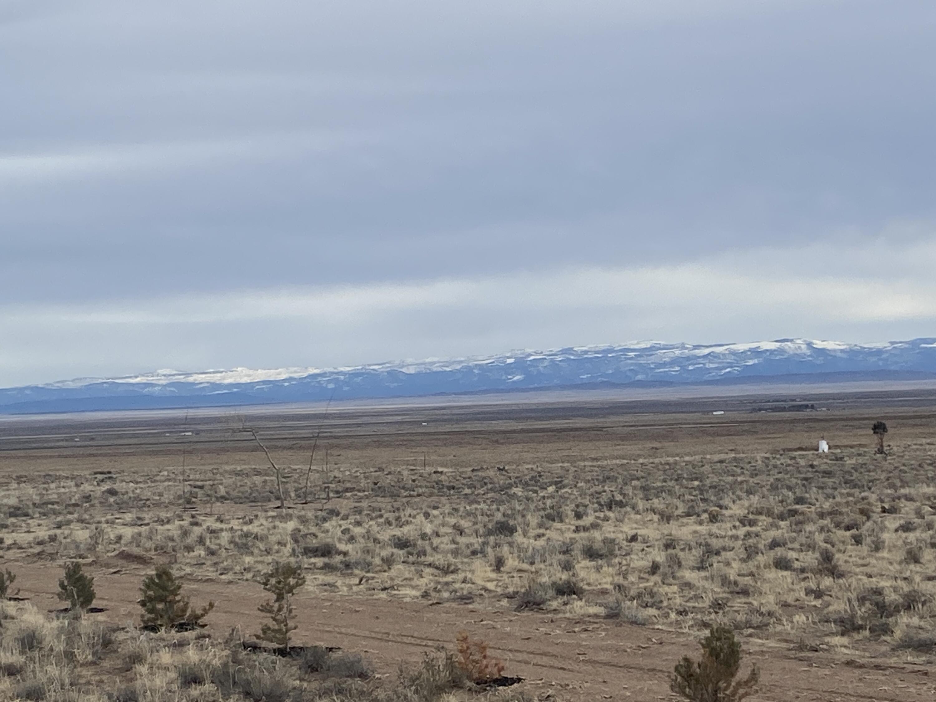 This might be the best piece of land in the Beryl/Lund area! Flat, grassy land with 1 Acre Foot of water (1945 Priority Date, #71-5760) and access via a deeded easement from the BLM. A dirt road has been cut in, making access with vehicles or a trailer very easy! Surrounded on 3 sides by either BLM or state land with 360 degree views! It is part of the SouthWest Desert Trophy Elk Unit. The property has a fence running down the west boundary and rough boundary corners are staked. Soils analysis provided in document section.
