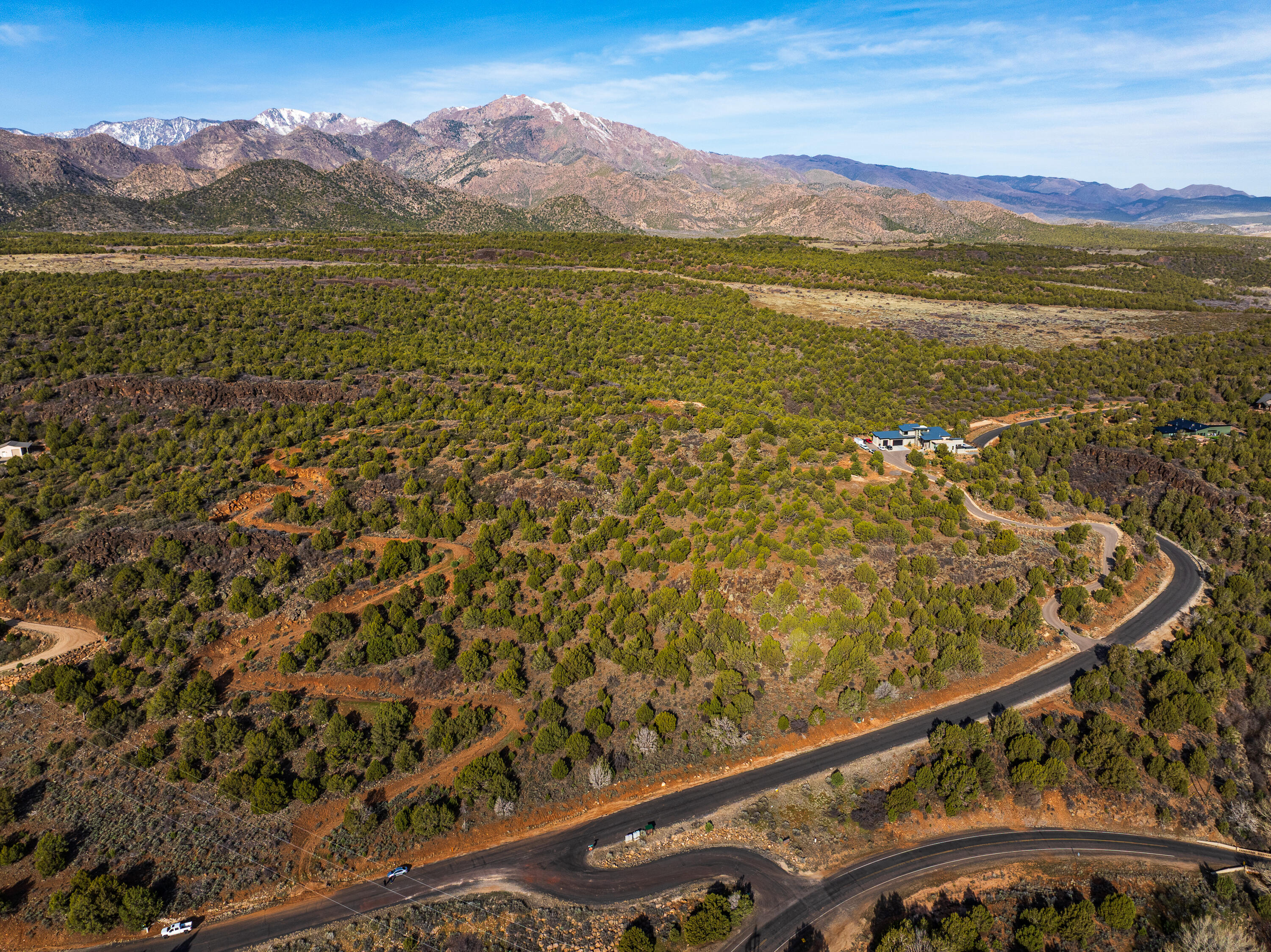 Imagine waking up to sweeping views, wide open skies, and the kind of quiet you can only find on acreage like this. Properties with this much land, this much potential, and views like these don't come around often. This stunning 16.04 acre property offers breathtaking, panoramic views in every direction and endless potential for whatever vision you have in mind. Whether you're dreaming of building a private estate with a massive shop, creating a multi-home family compound, or developing multiple homes, this property gives you the space and flexibility to make it happen. The land consists of three separate lots, allowing you the option to build up to three homes or keep it all for yourself and enjoy the privacy and wide-open space. A road was already put in a few years ago, giving you a great head start for future development and utilities are located at the bottom of the road.