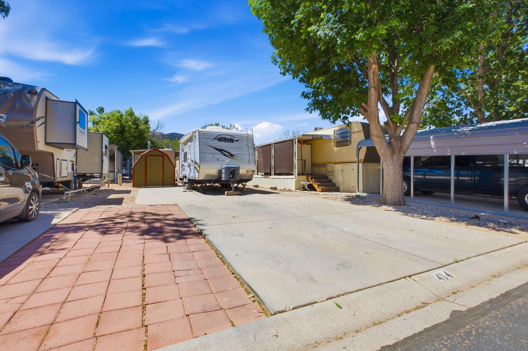 Rare opportunity to own up to three side-by-side lots (#415 & #416 also available) in the Foothills RV Park, offering the flexibility to create an expanded outdoor retreat or additional living space. Tucked away in Parowan, Utah, this hidden gem features full hookups, access to a community center, and peaceful surroundings with beautiful mountain views. Whether you're looking for a full-time residence, a seasonal escape, or a vacation getaway, these lots provide the perfect setting to relax and enjoy Southern Utah living. Ideally located just a short drive from Brian Head Ski Resort and surrounded by world-class outdoor recreation, including fishing, hiking, and hunting, while still offering convenient access to shopping, dining, services, and the freeway. Buyer to verify all information, deemed reliable, however buyer to verify all info including utilities, rental restrictions, and HOA information if applicable.