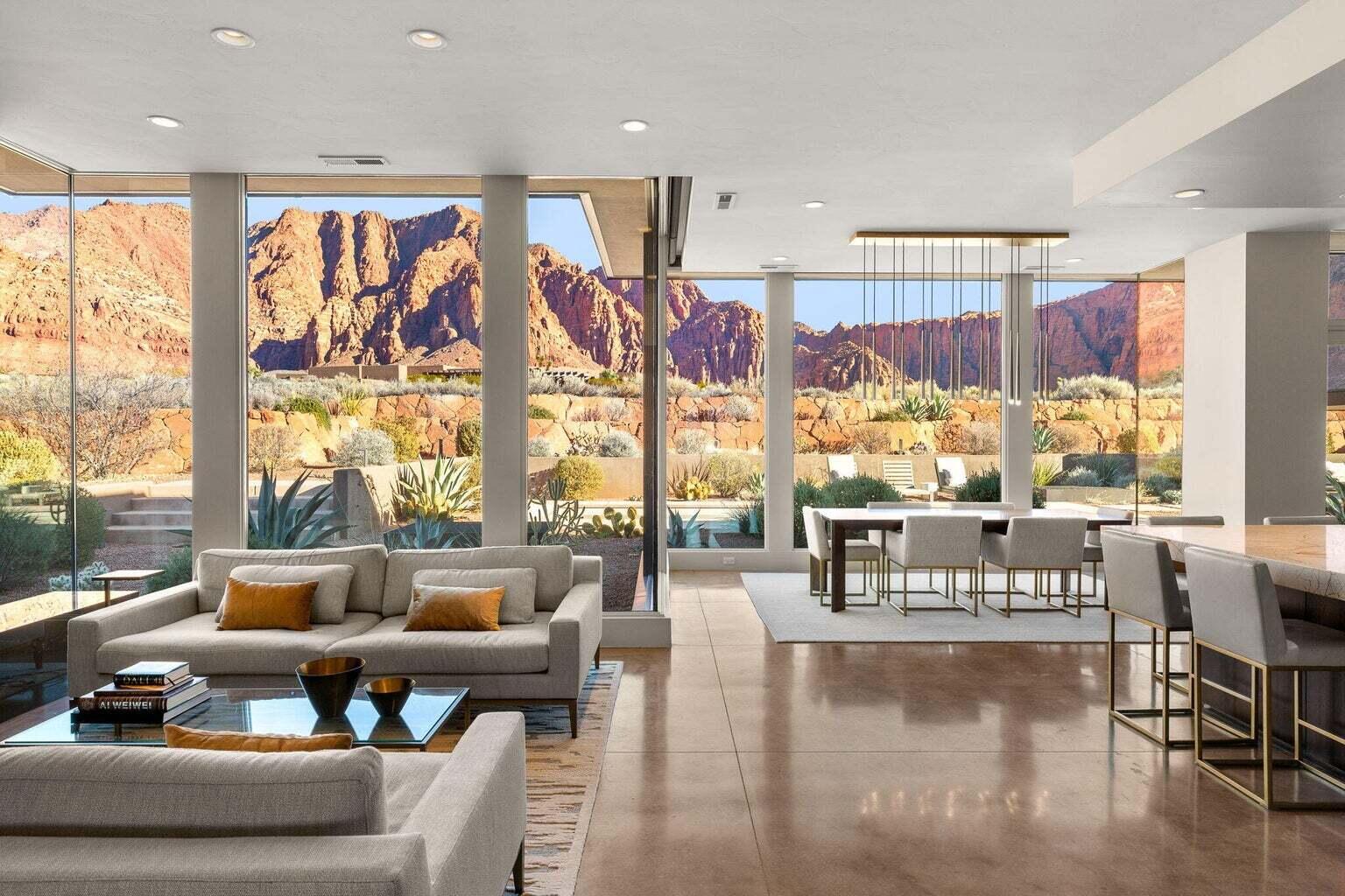 Set on over two private acres in the heart of Kayenta, this extraordinary residence is a true sanctuary where refined design meets the raw beauty of the desert landscape. Thoughtfully positioned to capture nearly three hundred sixty degree views, the home is wrapped in glass, light, and scenery, allowing the outdoors to become an ever present part of daily living.

From the moment you enter, the architecture and flow invite both serenity and connection. Two luxurious primary suites offer private retreats, while a designer chef's kitchen anchors the home with Brazilian and Neolith granite, top of the line Miele appliances, and a Sub Zero refrigerator with integrated air purification. Expansive mitered glass windows dissolve the boundary between inside and out, filling the home with natural light and framing the iconic red rock surroundings from nearly every room.

The residence is fully integrated as a smart home and features an eight zoned radiant floor heating system, providing effortless comfort year round. Custom walnut cabinetry and doors, paired with Restoration Hardware lighting and furnishings, elevate each space with warmth and timeless sophistication. A thoughtfully designed flex room adds versatility, adapting seamlessly to your lifestyle whether for work, wellness, or creative pursuits.

Outside, privacy and luxury continue. A heated saltwater pool and spa create a resort like setting, complete with a dedicated pool equipment house and a secluded outdoor shower. Multiple outdoor living spaces invite you to gather, unwind, or simply take in the stillness and beauty of Kayenta. A pergola with additional storage, a three car garage with extra depth and height, and fully xeriscaped grounds ensure both function and ease of living.

This is more than a home. It is a place of peace, presence, and elevated living, designed for those who value privacy, craftsmanship, and breathtaking views in one of Southern Utah's most inspiring communities.