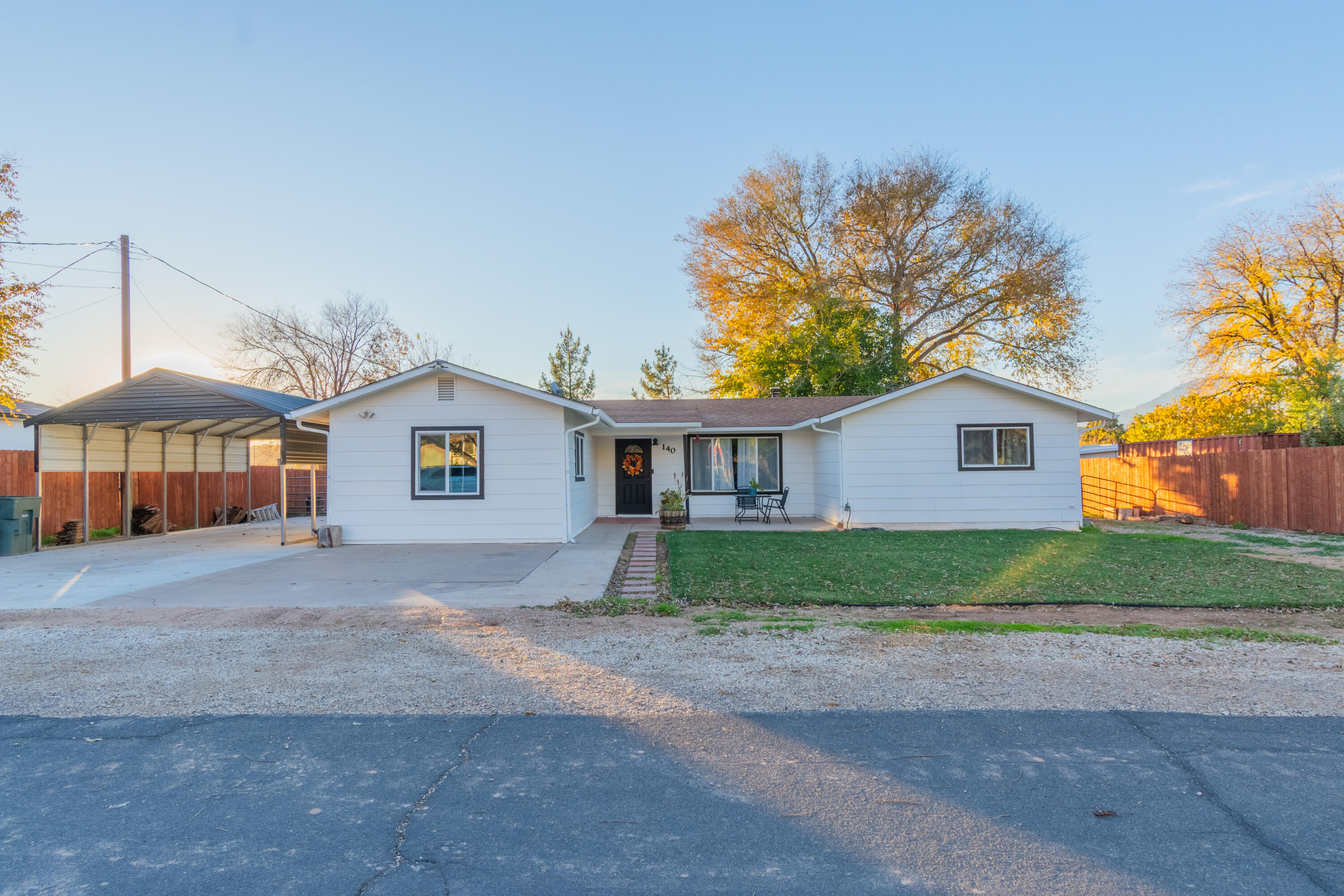 Beautifully renovated 3 bedroom, 2 bathroom home in an awesome neighborhood! This move-in-ready property features a newly built detached garage, and a convenient carport creating ample parking for cars and toys. 65 foot RV/Toy parking on north side of home. Watch amazing sunsets from Jacuzzi spa which stays with the home. Enjoy a spacious yard filled with gorgeous mature trees that provide shade, privacy, and a peaceful setting. With its stylish upgrades, great storage, and unbeatable location in a quiet neighborhood, this home is ideal for anyone! Don't miss out.