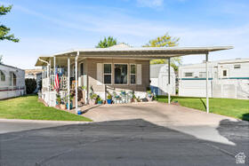 Located in Worldwide Sun Resort (#220), this well-maintained 2-bedroom, 1-bath home features beautiful mountain views from the covered deck, newer Whirlpool appliances, and fresh flooring throughout. Enjoy the rare benefit of owning your own lot in a vibrant 55+ community offering an indoor pool, hot tub, library, billiards room, craft and woodworking spaces, and a private dog park. HOA includes landscaping, water, and access to community amenities. Easy, low-maintenance living—schedule your showing today! Buyer to verify all information.