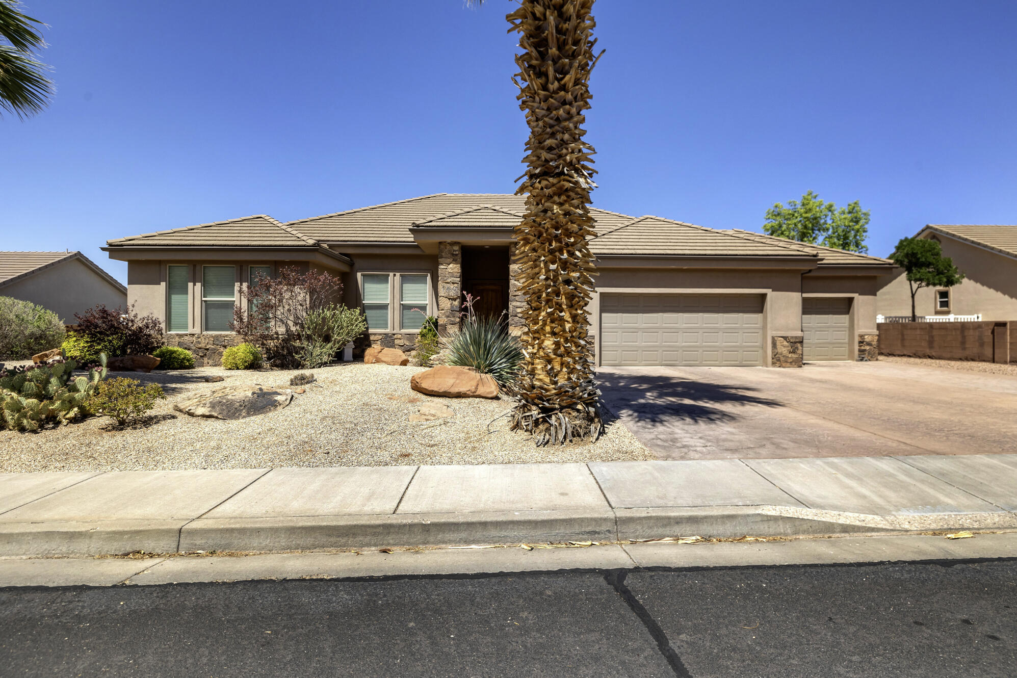 This Shadow Mountain rambler has it all. Four bedrooms, two full baths, and a 3-car garage with over 900 sq ft of space plus RV parking. Single level living with no HOA, so you get the space and freedom without the extra rules or fees.

The back patio has an awning that's perfect for your morning routine or just hanging outside without worrying about the sun. Curb appeal is strong too, with low maintenance landscaping that keeps things easy.

Inside you'll find a huge master bedroom with a spa-like bathroom, separate tub and shower, and double sinks. Real wood interior doors and trim, tile backsplash, 10 ft ceilings, and a split floor plan round it out.

Location is hard to beat too, you're close to literally everything in St. George. Move-in ready and worth a look.

Square footage figures are provided as a courtesy estimate only and were obtained from county records.  Buyer is advised to obtain an independent measurement.