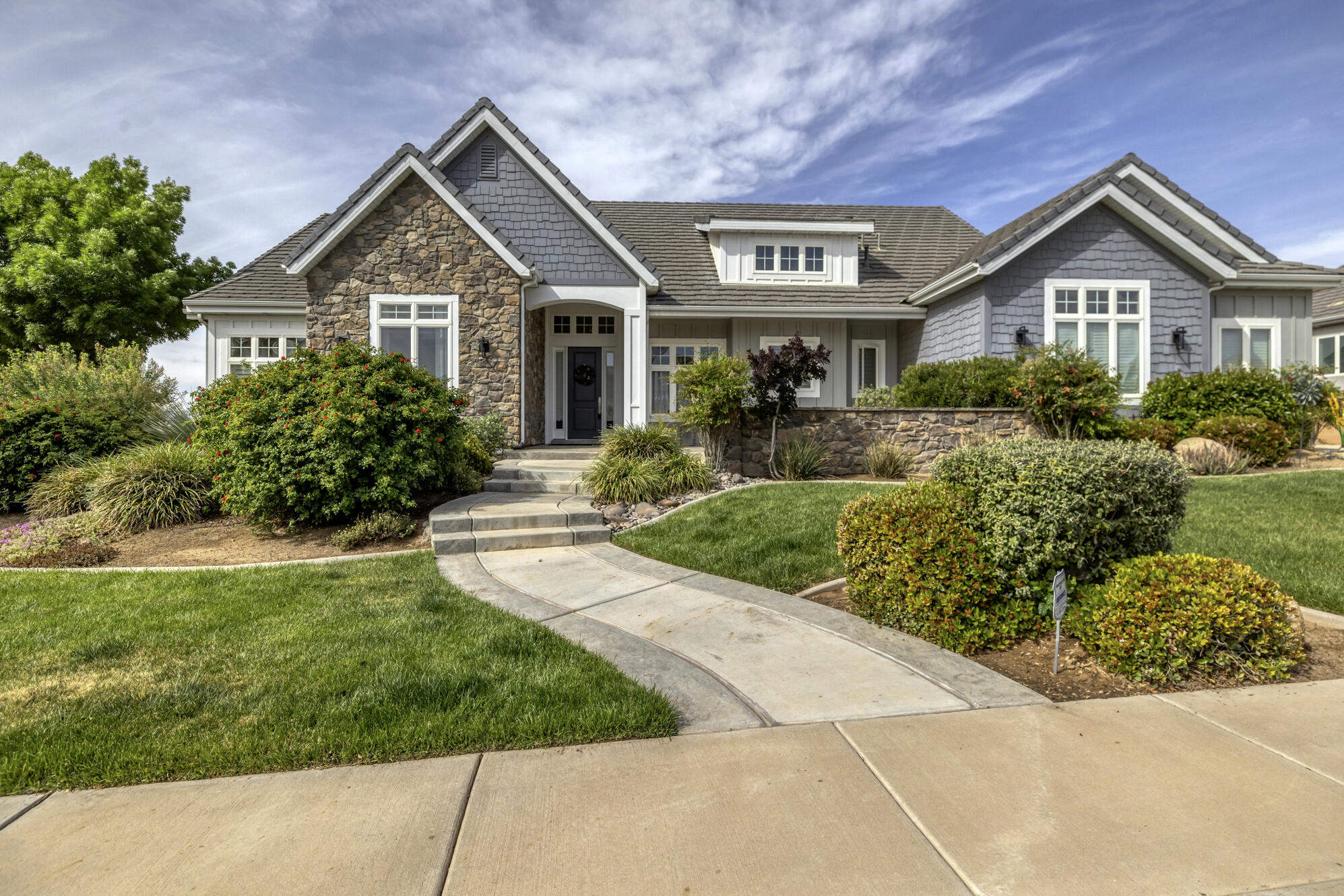 Location! Location! Location! Views, space, and a location that's hard to beat. Located on the ledge of Foremaster Ridge, this stunning home overlooks St. George and offers the kind of views you'll never get tired of. From the moment you walk in, the home feels bright, open, and welcoming with a layout designed for both everyday living and entertaining. Tons of windows fill the home with natural light while showcasing the scenery. Several bedrooms feature en-suite bathrooms upstairs and downstairs, plus the walk-out basement opens from multiple rooms for added convenience and flexibility. Tall ceilings throughout create a spacious feel, while tray ceilings in the primary suite add character and charm. Featured in the Parade of Homes in 2013, this home is a rare opportunity in one of St. George's most desirable areas. Buyer and Buyers Agent to verify all information