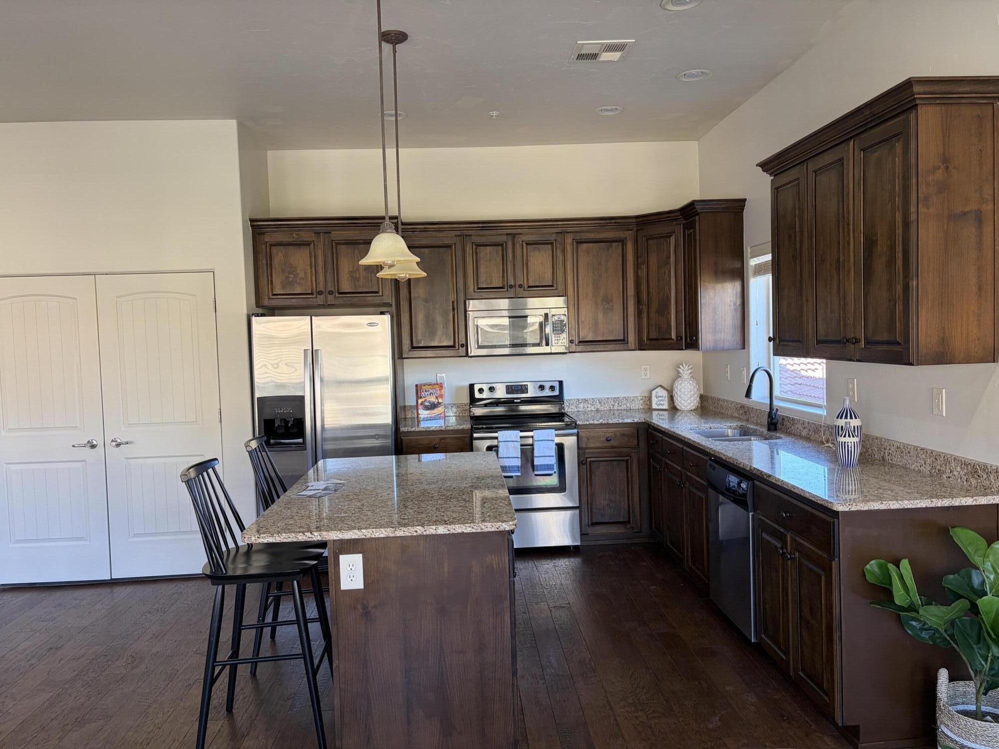 $10,000 SELLER CONCESSIONS!! Use for buying the interest rate down, pay HOA fees, closing costs, etc. Pine Valley views from primary bedroom and kitchen! Nicely kept, freshly painted condo in the coveted Bella Terrazza community in Sunbrook! Two comfortable bedrooms, large great room, fireplace, and nice, open kitchen. You will love the community with pool, hot tub, community center, fitness center. HOA includes exterior maintenance and insurance, sewer, water, garbage, and full yard maintenance. Get your steps in, without a gym membership!! :) Come and see it today!