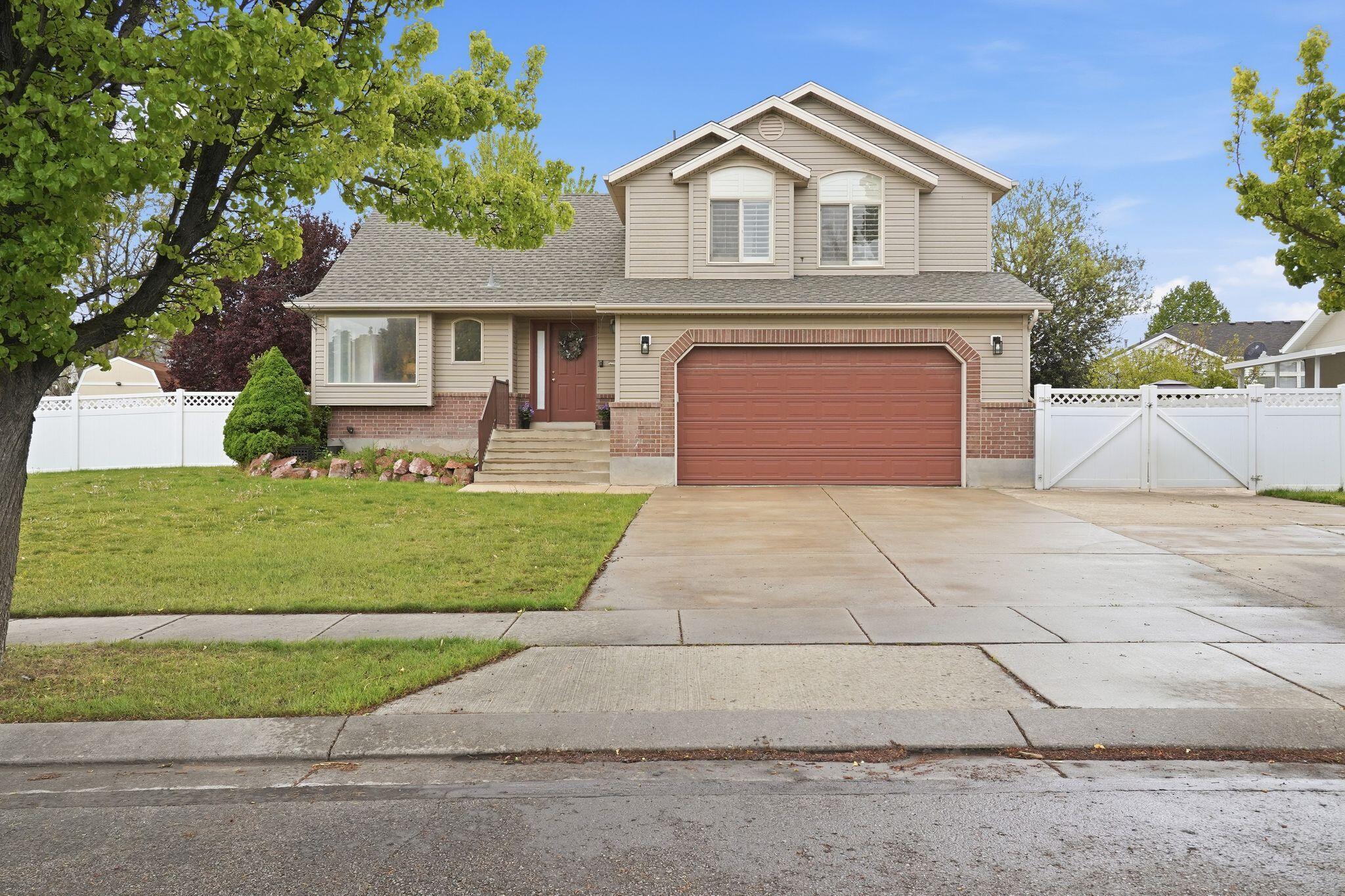 Beautifully maintained home in a highly desirable West Jordan neighborhood, offering the perfect blend of comfort, updates, and location. Fantastic views that will never be blocked. Step inside to an open and inviting layout with vaulted ceilings, abundant natural light, and updated flooring throughout the main living areas. The kitchen features refinished cabinetry, ample counter space, and stainless steel appliances, flowing seamlessly into the living and dining spaces-ideal for everyday living and entertaining. This home has been thoughtfully updated with a new roof (Nov 2025) and major system upgrades including furnace, A/C, and more, providing peace of mind for years to come. The spacious primary suite and additional bedrooms offer flexibility for family, guests, or a home office. Outside, enjoy a fully fenced backyard with a covered patio, mature landscaping, and plenty of space to relax or play. Extra driveway parking and dedicated RV parking add rare convenience. Located within short distance to Jordan Hills Elementary, parks, library, and community amenities including a pool, green space, and playground.
