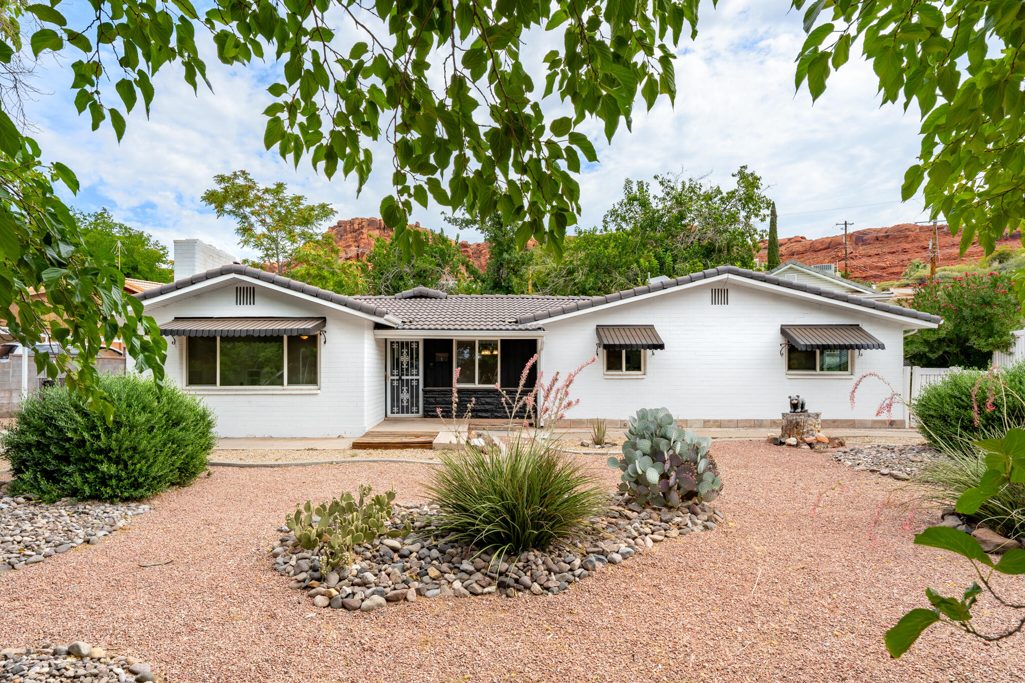 Huge price reduction on this multi-generational property! 2 homes on one 1/3 acre property! Amazing, fully remodeled downtown St. George property that has a full ADU on the property that can also be used legally for select businesses or as a residence. Main home has 3 bedrooms with 2 bathrooms. ADU has large family room/bedroom, spacious kitchen, full bathroom, stacking washer/dryer covered carport, cozy porch and large storage room. ADU is occupied. Tenant is paying $1,500 a month. Would love to stay but would terminate his lease if new owners so choose. Must set up an appointed to see back home. Front home is vacant with a code box 3619