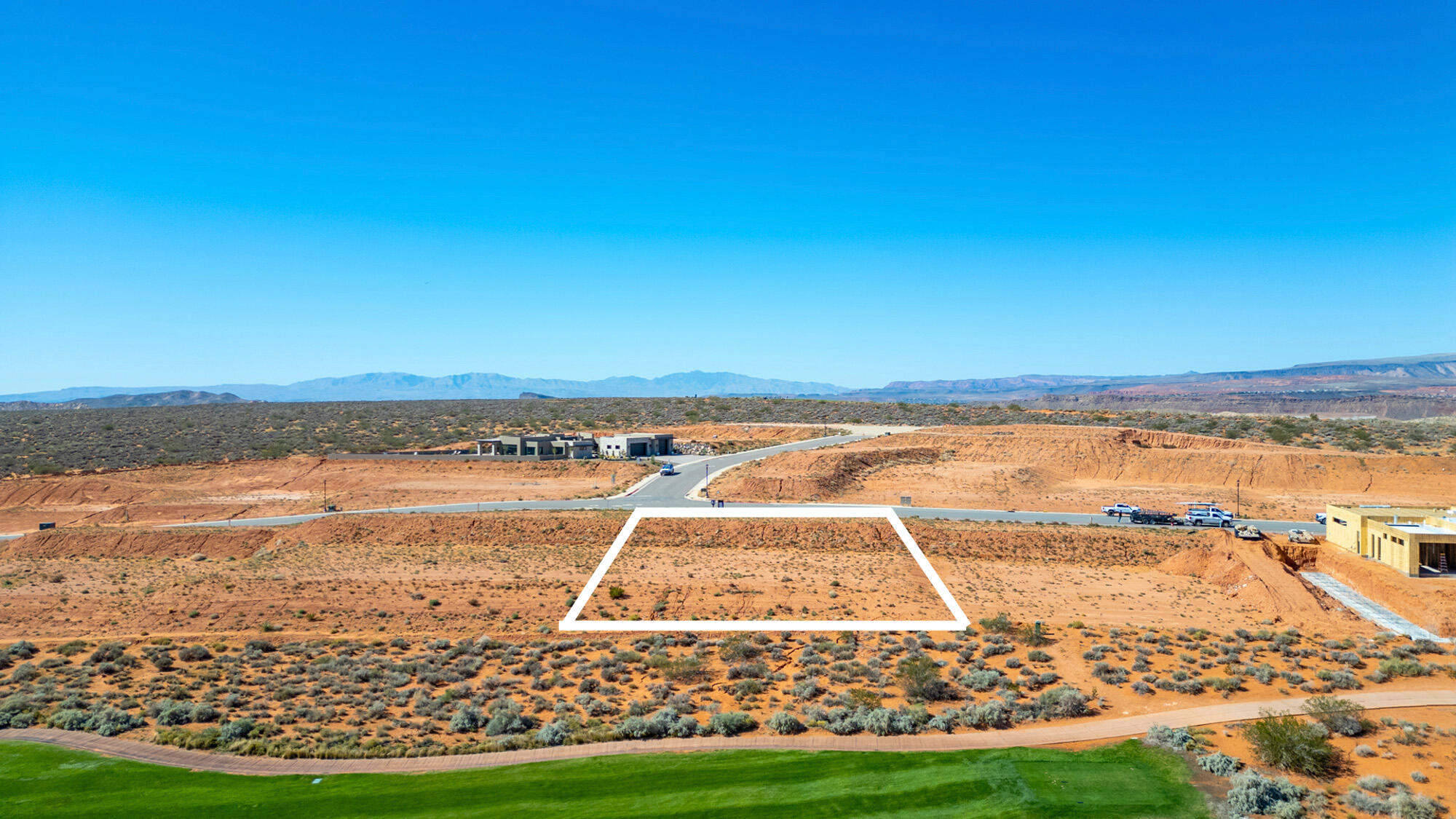 With over half an acre, this premium homesite offers an exceptional opportunity to build a custom dream home or luxury retreat, surrounded by panoramic views of the Red Rock Cliffs, Zion National Park, and Mollie's Nipple, and ideally positioned on Hole #17 within one of Southern Utah's most sought-after resort communities. Enjoy access to championship golf, off-road trails, and year-round recreation, all while maintaining a more private, upscale residential setting. What truly sets this lot apart is its quieter positioning--minimizing through traffic, reducing road noise, and limiting headlight intrusion--creating a more peaceful living experience compared to interior or main-road homesites. Protected view corridors preserve your long-term sightlines, adding both daily enjoyment and future resale value. Designed for a walk-out basement, this property allows for a smarter, more functional build, offering flexibility for additional living space, guest quarters, or seamless indoor-outdoor flow. A key advantage is the ability to build more efficiently--a 5,000 sq ft two-story home requires only a 2,500 sq ft footprint, leaving significantly more usable yard space than a traditional single-level design, with ample room for a pool, outdoor kitchen, entertaining areas, and expanded garage space for boats, RVs, or recreational vehicles. Up to $25,000 in preferred builder incentives may be available, depending on purchase terms--making this not just a homesite, but a strategic opportunity to build smarter and live better in Southern Utah. Ask the agent about preferred builder. where world-class design and luxury meets the adventure and natural beauty of Southern Utah. Minutes from Sand Hollow Reservoir, Zion National Park, and endless outdoor recreation, this is more than just a place to liveit's a place to experience your legacy.
Seller has conceptual floor plans and renderings that can be included in the cost of the lot.