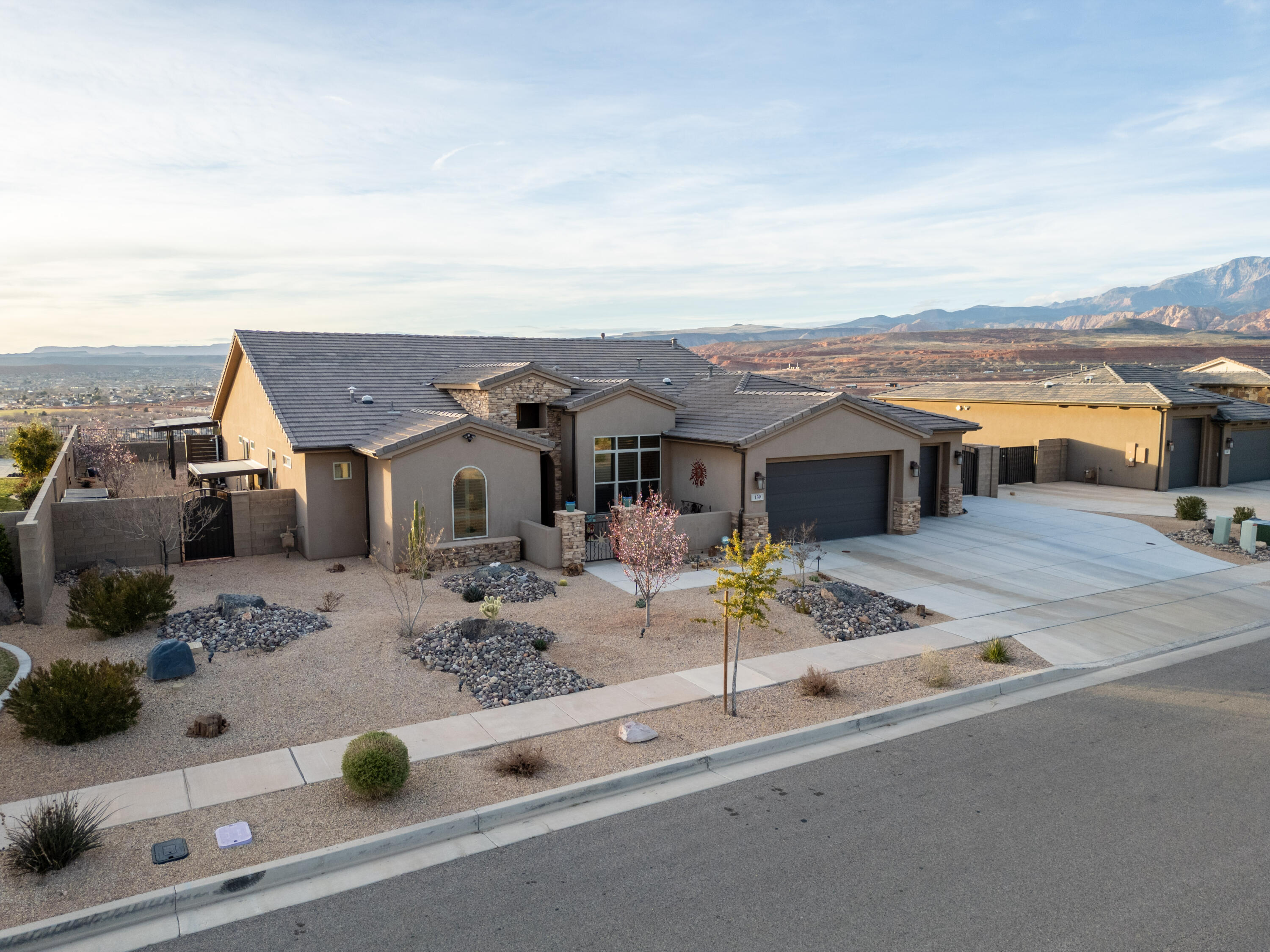 Wake up above the valley on one of Coral Canyon's rare rim lots--where privacy, panoramic views, and elevated outdoor living come together.

This 4 bed, 2.5 bath home is designed for both everyday comfort and effortless entertaining, with an open-concept layout that flows seamlessly to a resort-style backyard featuring a pool, spa, and outdoor kitchen--perfectly positioned to capture unobstructed views and unforgettable sunsets.

Inside, natural light fills the spacious living areas, complemented by a well-appointed kitchen with custom finishes and a thoughtfully designed split floor plan offering both privacy and functionality. A dedicated gym or flex space adds versatility to fit today's lifestyle.

Notable upgrades include electric shades, a whole-home water filtration system, and additional parking--enhancing both convenience and livability.

Step outside to your private backyard retreat or explore miles of scenic trails with direct access right from your doorstep.

Located just minutes from golf, dining, shopping, and everyday amenities, this meticulously maintained home offers a rare combination of location, lifestyle, and views--making it one of the most compelling opportunities in Coral Canyon.