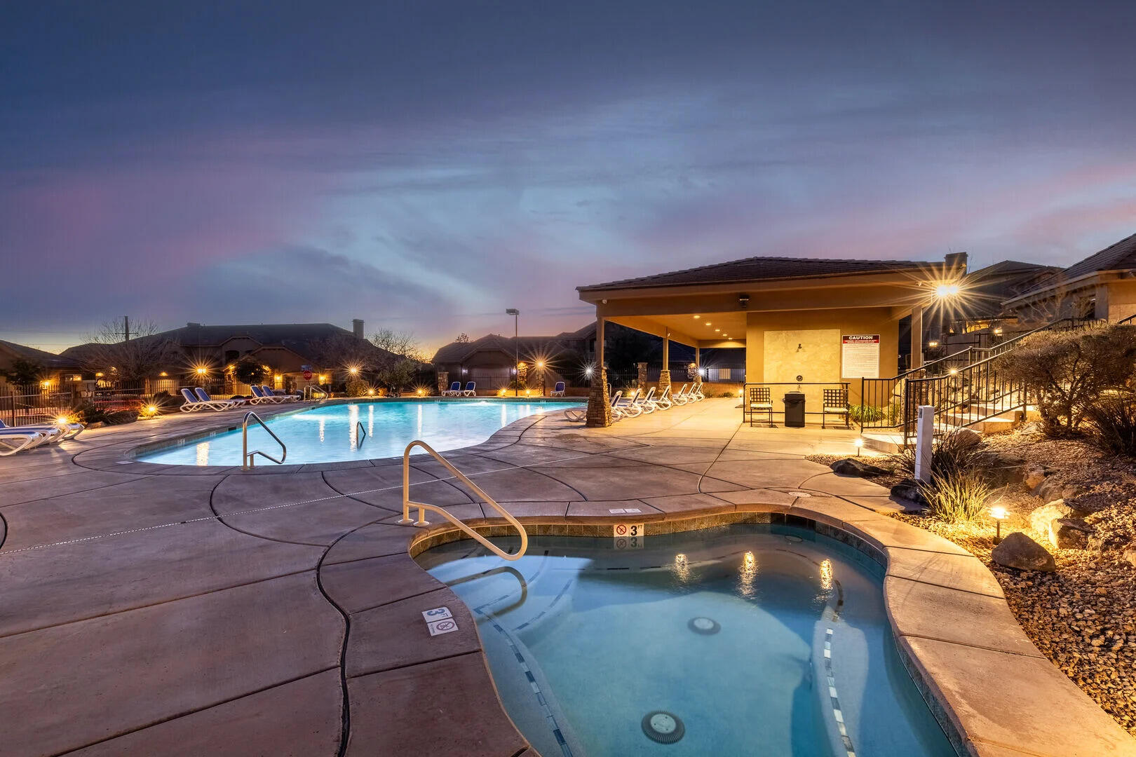 A luxurious vacation home in the scenic Coral Ridge community of St. George. Inspired by the Kolob Canyons of Zion National Park, this beautifully maintained 3-bedroom, 3.5-bath residence offers a peaceful fishing-pond and Southern Utah mountain views and is just 32 miles from Zion, making it an ideal base for outdoor adventures. The spacious master suite includes an en-suite bath, accompanied by two additional well-appointed bedrooms and a total of 3.5 baths. Entertain and relax in the main-level living room with fireplace, large flat-screen TV, DVD player and leather seating with direct access to a patio with BBQ and outdoor seating, or retreat to the upper-level second living room with additional seating, TV/DVD and a balcony with desert and mountain vistas. The gourmet kitchen features stainless steel appliances, granite countertops, island seating for four and a fully stocked kitchen; a formal dining room seats six. Additional highlights include a two-car garage and Coral Ridge community amenities such as two outdoor heated pools, a hot tub and a fitness center. Perfect for vacationing families or investors seeking a high-end short-term rental in a premier Southern Utah location -- contact for showings and more details.