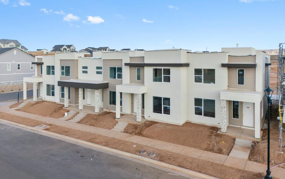 NEW TOWNHOME UNIT! You won't want to miss this opportunity! This spacious townhome features an open layout on the main level. The kitchen is finished with quality white cabinets with sleek white quartz countertop. Upstairs has a nice loft space and the bedrooms have generous closets. Primary bathroom has beautiful luxurious shower with tile surround and euro glass. This home has access to the amazing Desert Color amenities including the 2.5 acre lagoon, pool/hot tub, and pickleball courts. This home is not nightly rental approved. Pictures of home are of the model home which is an end unit. Please call Matt Shelton with any questions. Thanks!