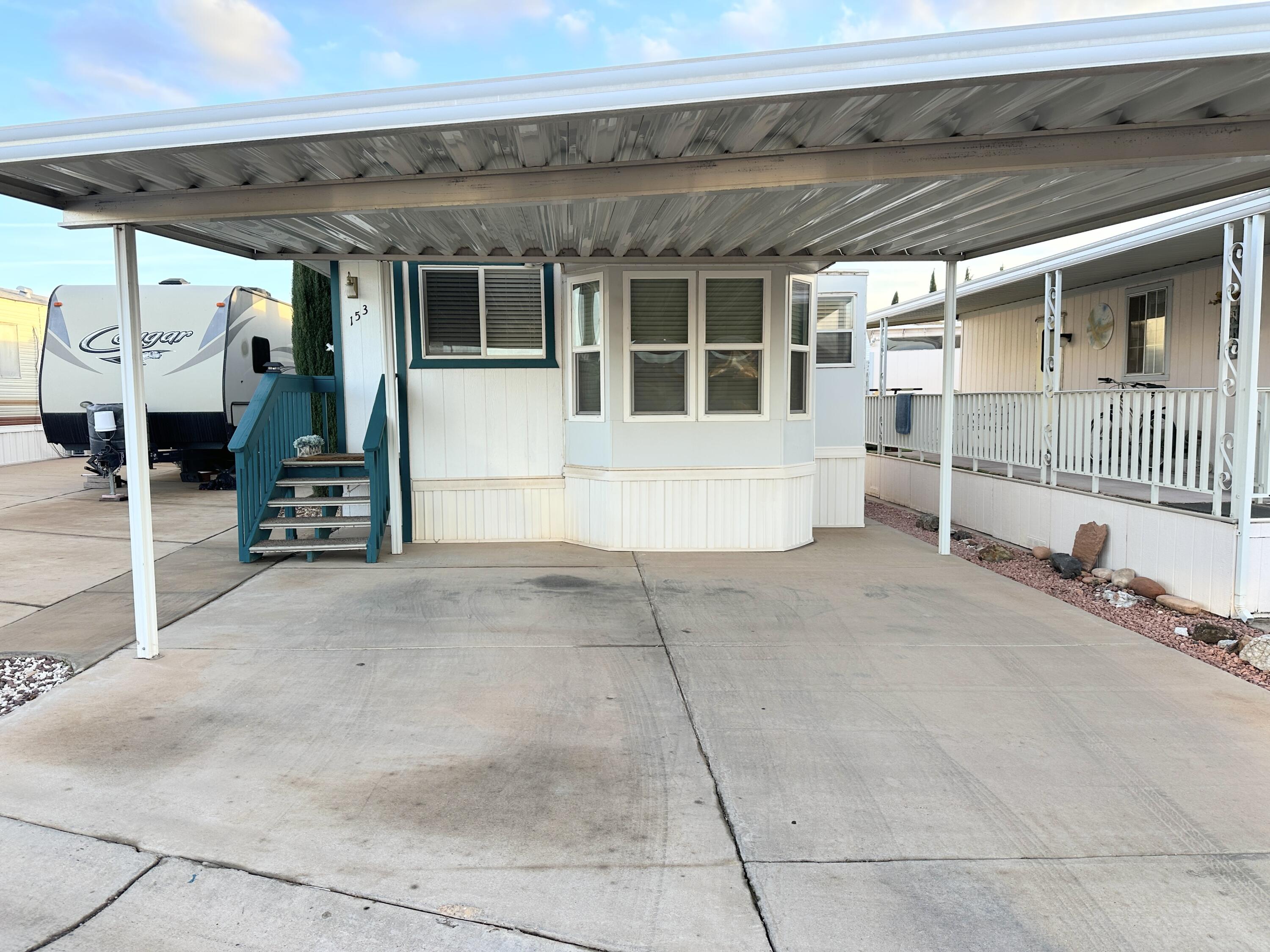 Enjoy southern Utah's warm weather in this 55+ community. Rare to find a real 2 bedroom with large closets. New flooring in kitchen and bedrooms. Washer and dryer in the home. Covered parking! This community has two clubhouses and an indoor pool and hot tub. Enjoy the many activities and get togethers. Close to grocery stores, restaurants, shopping, Snow Canyon State Park and Tuacahn Center for the Arts.