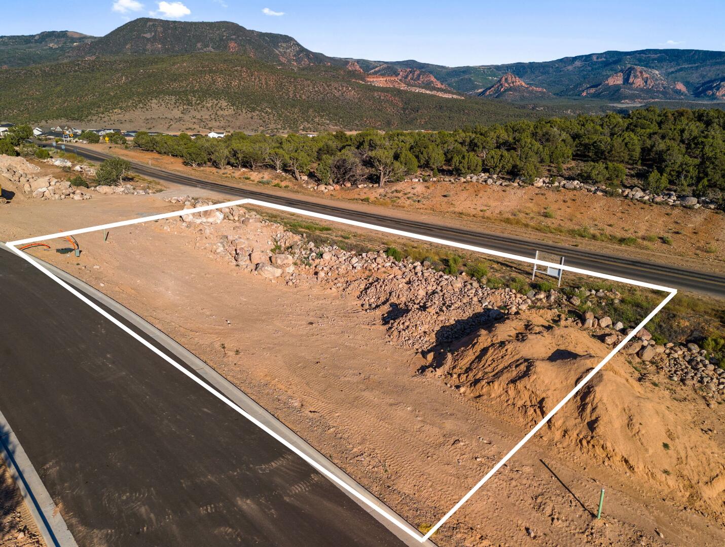 This is Lot Number 5, a .36-acre homesite located in the highly sought-after Estates at South Mountain subdivision. Enjoy stunning views of Shurtz Canyon and the surrounding Southern Utah mountains. This growing community is positioned near planned future elementary, middle, and high schools, adding long-term value and convenience. Bring your own builder or choose to build with the South Mountain Development Group. Don't miss this opportunity to secure a premium lot in one of Cedar City's most desirable neighborhoods. No HOA.