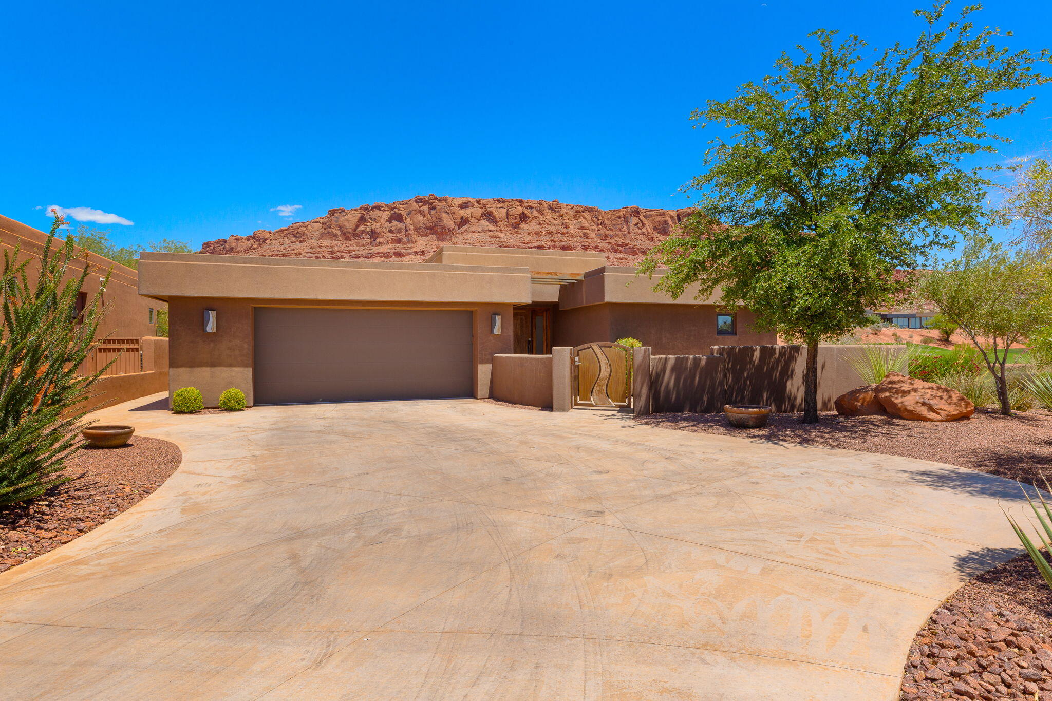 Set among the red Kachina Cliffs, the tranquil stream running by the patio as you gaze out at the green of hole #6 of the Entrada Golf Course, your heart slows as the peace and beauty of the stunning views envelopes your soul.  From every room the vivid reds of the cliffs and green of the golf course enters your view.  With 3 bdrms plus an office or a 4th bdrm.  A kitchen that is warm and inviting asking you to enjoy a meal at the dining table.  This is a home you don't want to miss.  The spacious primary bdrm, bathroom and closet, oversize 2 + car garage, plus so much more
    HOA dues are $542.72 per month and cover the private roads, gates, security guards, all outside maintenance of the home (front, sides & back), all the stream (water) maintenance, all common area maintenance and the HOA pool facilities.
   Home also comes with a free Associate Membership to the Entrada Country Club (used to be a one-time fee of $15,000, now - no charge) with monthly dues only $234.30, which gives you full access to the Entrada Clubhouse and to the Entrada Private Gym/Wellness Center which includes tennis courts, pickelball courts, full weight room, outdoor pool, basketball court, volleyball & 4-6 classes per day (yoga, Pilates, zumba, etc). Sports/Wellness Center is open 7 days a week 6am - 8pm. Also comes w/an $800 food min per year (about $66 per month) for use at Entrada Social events, snack bar, grille & restaurant. Live the Amazing Entrada Lifestyle! Have instant new friends with many events going on at the Country Club weekly. There are group hikes, bike rides, skiing, Tuachan, bridge, mahjong, knitting and book clubs, etc. all part of the Entrada Country Club