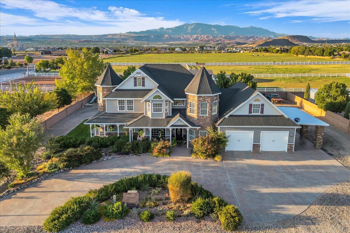 This charming Victorian-style home, zoned for HORSE PRIVILEGES, is tucked away in a quiet cul-de-sac and has city approval for a second dwelling next to the primary residence! It includes two additional parcels—one is 1.20 acres and the other is 0.92 acres, offering space, privacy, and incredible potential. 
Inside, you'll find beautiful flooring throughout, granite countertops, Café appliances, and tons of storage—including an 845 sq ft garage. There's also a gorgeous front porch, a circular drive in front, plus a driveway that wraps all the way around the house.
The home features 4 bedrooms, 2 full baths, 2 half baths, and 2 family rooms—plenty of space and flexibility.
This is more than a home—it's a rare opportunity to own a private retreat with room to expand.
Buyer to verify all information.