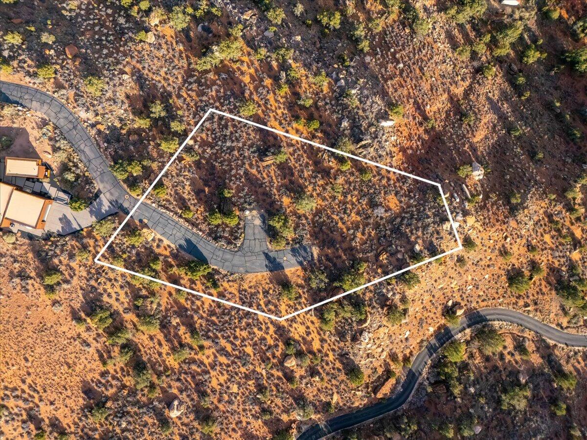 Walk in silence, savoring champagne beneath angelic sunsets on the edge of Zion. This is for the buyer who doesn't ask permission--someone who chooses what others simply can't have.

Tucked within a private, gated enclave of just six home sites, the Claret Cup subdivision offers rare seclusion and a true sense of arrival. A generous building envelope invites you to shape a home that captures the cliffs, the light, and the vast open space in a way that reflects your vision.

Whether bold and modern or understated and serene, this lot offers the freedom to create without compromise. Every vantage point reveals a different expression of Zion--morning shadows, evening color, and a stillness that feels entirely its own.