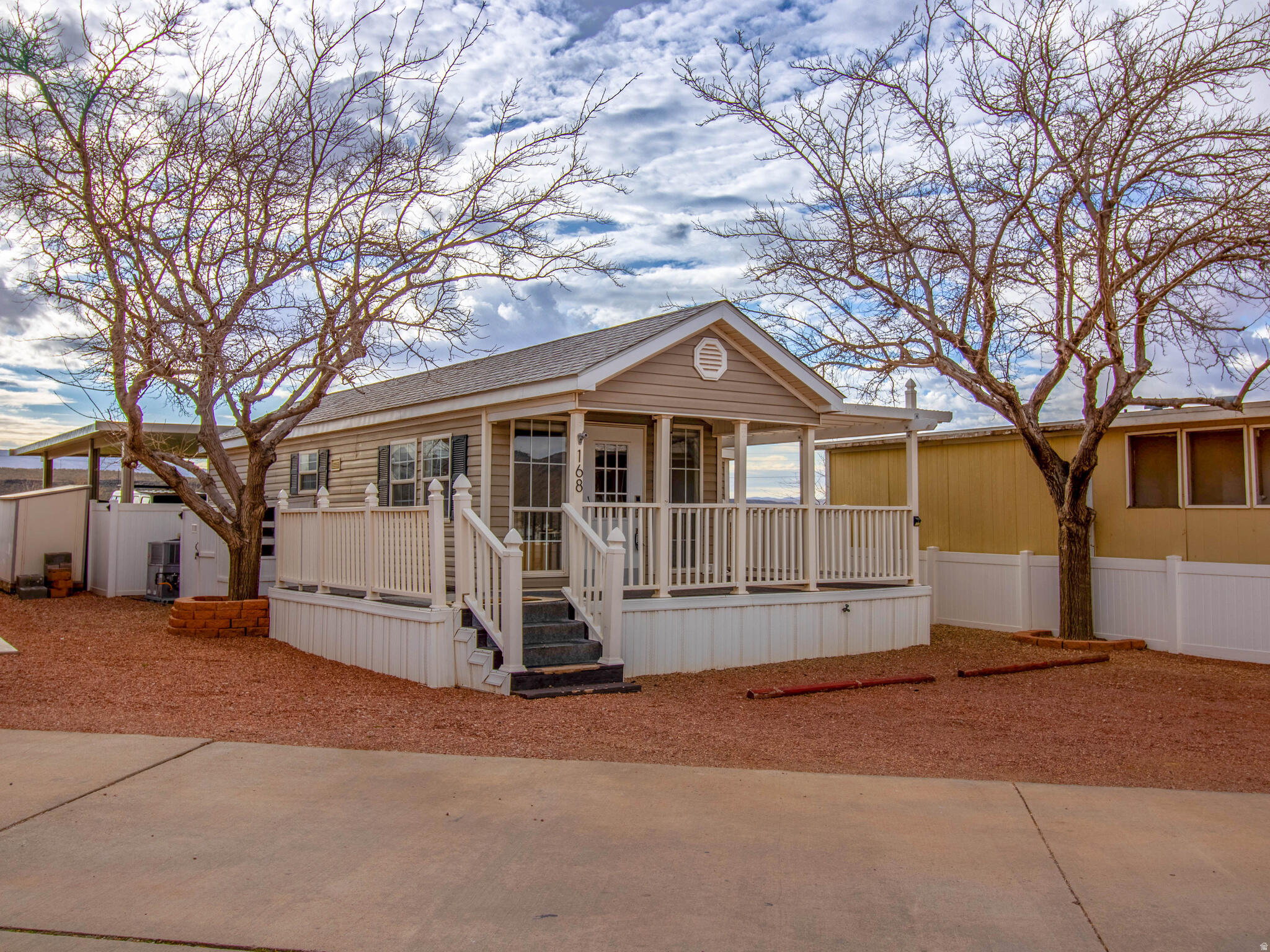 A Southern Utah Gem!! The Snowbirds Dream!! A ''Part Timers'' Delight!!! Whatever you want to call it this newly updated Park Model is the perfect fit! YOU OWN THE LOT! This is deeded dirt so investors take notice!! FINANCABLE TOO! The use of space on this lot has been carefully thought out, installed and maintained weekly by a professional landscape company,  Enjoy this private  backyard with views to the South of Sand Mountain and the most amazing Southern Utah sunsets. Complete with a  palm tree, san pedro cactus, blue agave cactus, fresh landscape rock and paver patio this backyard is ready to entertain. This is the perfect location to take in all the offerings of Southern Utah. Conveniently situated right by Walmart, Maverick and easy access to Hwy 7, Hwy 9, and I15 you are just 30 minutes to the gate at Zion National Park. The airport is just 22 minutes from the door step. This home is located in Zions Gate RV Resort that offers an indoor swimming pool, hot tub, pool table, flex space, and laundry facility. When you step inside this adorable home you will find a fresh updated space complete with new floors, doors, paint, fixtures and brand new trendy Cafe Appliances! This home is cozy, funtional, well layed out and you will not find a home at this price located this close to all the things!!! Square footage taken from county records. Buyers and buyers agents to verify all information.