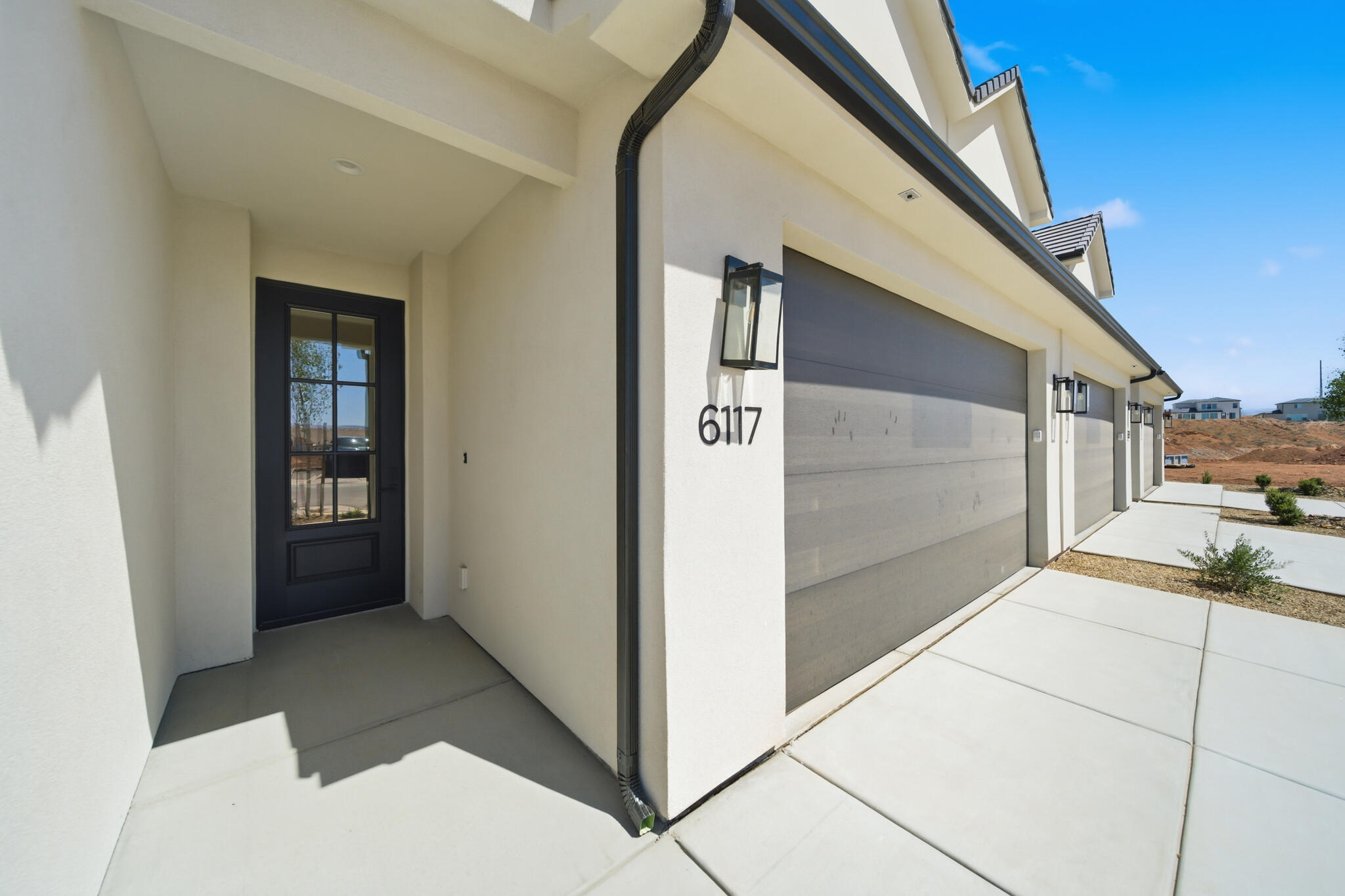 This townhome is anything but typical! Elevated finishes and thoughtful design shine throughout this beautifully appointed home. The open-concept main level offers a spacious living area filled with natural light from oversized windows and an impressive 6080 sliding glass door off the dining room. The gorgeous kitchen is designed for both functionality and entertaining, featuring an extra-long island, abundant cabinetry, and convenient pull-out garbage cans built directly into the island. Step outside to enjoy added privacy from the back porch thanks to the enclosed block wall with gate.

Upstairs, a generous loft creates the perfect second living room, media space, or flex area. The luxurious primary suite boasts a spa-inspired bathroom complete with high-end finishes, an extra-wide double vanity, and ample cabinet storage. Both the primary and guest bathrooms feature beautifully tiled showers that elevate the home even further. And unlike many townhomes, this rare oversized garage offers extra depth so you can comfortably park a truck inside.

Located in an area experiencing exciting growth, this community offers increasing convenience and future value. Enjoy having the new Maverik gas station just kiddy-corner to the neighborhood, with additional commercial tenants and amenities coming soon. A truly exceptional opportunity combining style, comfort, functionality, and location!

Photos of finished home are for visual assistance only. Actual home may differ in color/finishes. Contact me for more info.