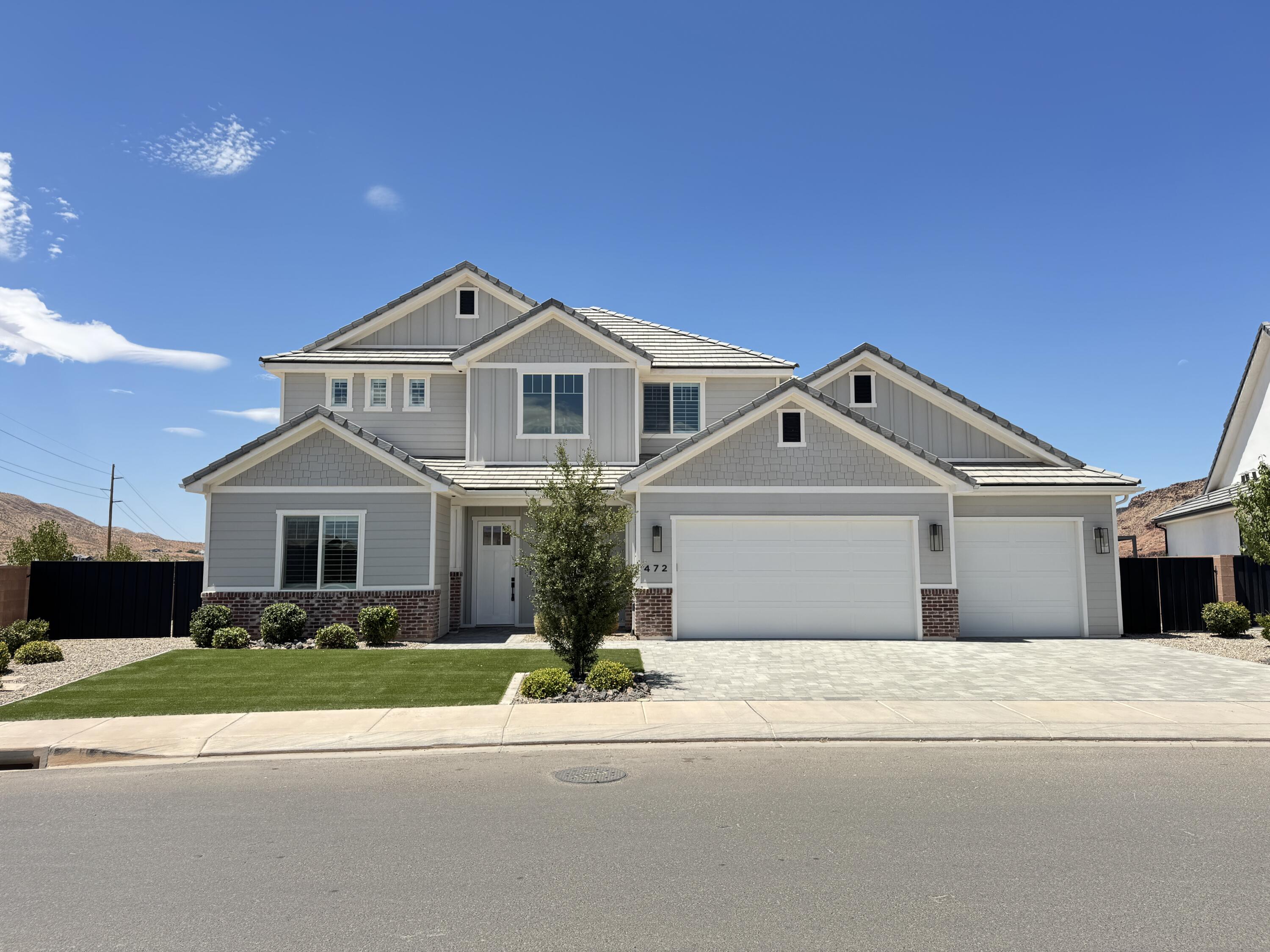 Beautiful home tucked in the quiet Red Mesa subdivision! Featuring an expansive yard with awning, artificial turf, low maintenance plants & paver patios/driveway. Spacious layout with an impressive 2 story entry way, picture windows & 10' ceilings on the main level. Massive kitchen featuring Cafe appliances, quartz countertops, large island, butler's pantry & extra cabinetry. Primary suite boasts a private thermostat, dual vanities, walk-in shower, garden tub & walk-in closet. High-end finishes throughout including motorized blinds, plantation shutters, hardwood floor, quartz countertops, artistic millwork, upgraded light fixtures, custom cabinetry & ample storage.